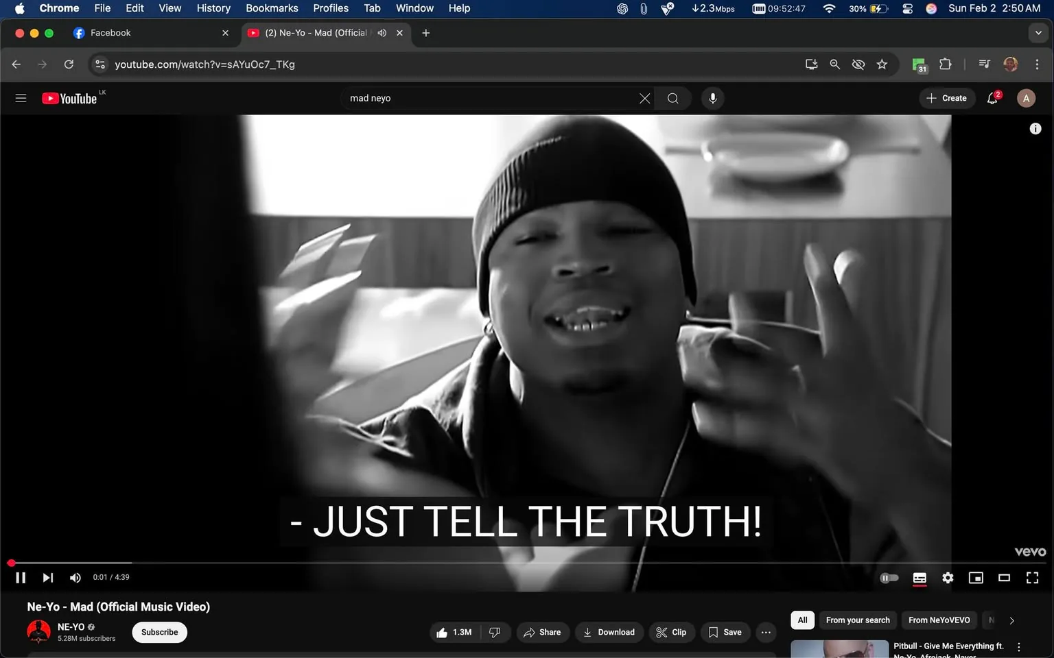 In the scene, a man is prominently featured, expressing himself with animated gestures and a serious expression. He appears to be in a casual setting, possibly indoors, as indicated by the background elements like a wooden table and plates. The man is wearing a black beanie and a dark hoodie, which gives him a relaxed yet intense look. His facial expression suggests he is conveying strong emotions, likely frustration or urgency, as he gestures with his hands. 

The text overlay reads, "JUST TELL THE TRUTH!" in bold, white letters, emphasizing the emotional weight of the moment. The overall color scheme is monochromatic, adding to the dramatic effect of the scene. The video appears to be part of a music performance, likely a hip-hop or R&B genre, given the context and the man's style. There are no visible brands or logos in the image, and the setting does not contain any elements that suggest violence or sexual content.