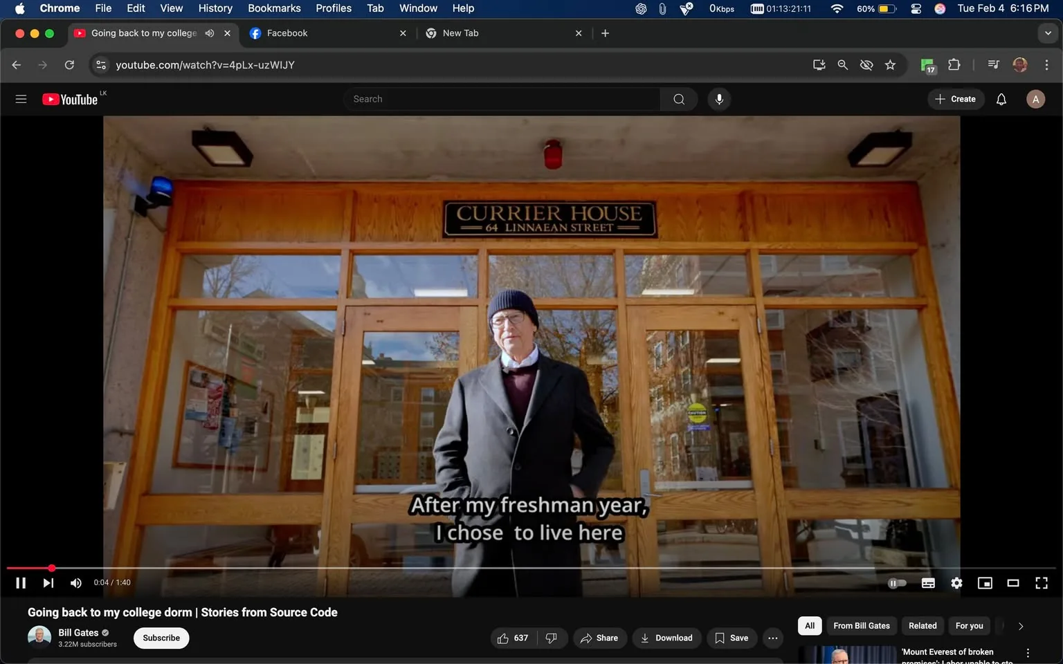 In the image, a man stands in front of a building labeled "CURRIER HOUSE" with the address "64 LINNAEAN STREET" prominently displayed above the entrance. The man appears to be in his 60s or 70s, wearing a dark coat and a black beanie. He has glasses and is looking directly at the camera with a neutral expression. The setting is outdoors, with large glass doors that reveal a glimpse of the interior, which seems to be well-lit. The background features trees, indicating it might be early spring or late fall, as some branches are bare. The text overlay at the bottom reads, "After my freshman year, I chose to live here," suggesting a personal narrative related to college experiences. There are no visible brands or logos other than the building's name. The overall atmosphere is calm and reflective, likely capturing a moment of nostalgia.