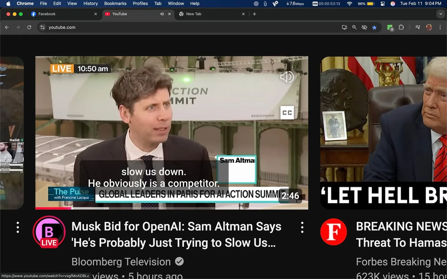 The image displays a screenshot from a YouTube video. The video appears to be a live broadcast featuring a man with curly hair and a suit, who is speaking into a microphone. He has a serious expression and is gesturing with his hands as he talks. The text overlay on the video indicates that it is live at 10:50 AM and includes subtitles that read, "slow us down. He obviously is a competitor." The man's name, "Sam Altman," is displayed in a lower third graphic.

In the background, there is a large banner that reads "AI ACTION SUMMIT," suggesting that the event is related to artificial intelligence. The setting appears to be an indoor venue with a spacious layout, featuring arches and a light-colored wall. There are also tables or booths visible in the background, indicating a conference or summit environment.

To the right of the main video, there is a thumbnail for another video titled "BREAKING NEWS: Threat To Hamas," featuring a man with gray hair sitting in a chair, looking serious. The background includes a flag and a framed photo on a desk, suggesting a formal setting, possibly an office.

The overall layout of the image shows a dark-themed interface typical of YouTube, with various video thumbnails and text descriptions visible on the left side. The video player controls are also present at the bottom of the image, indicating that this is a digital platform for viewing content.
