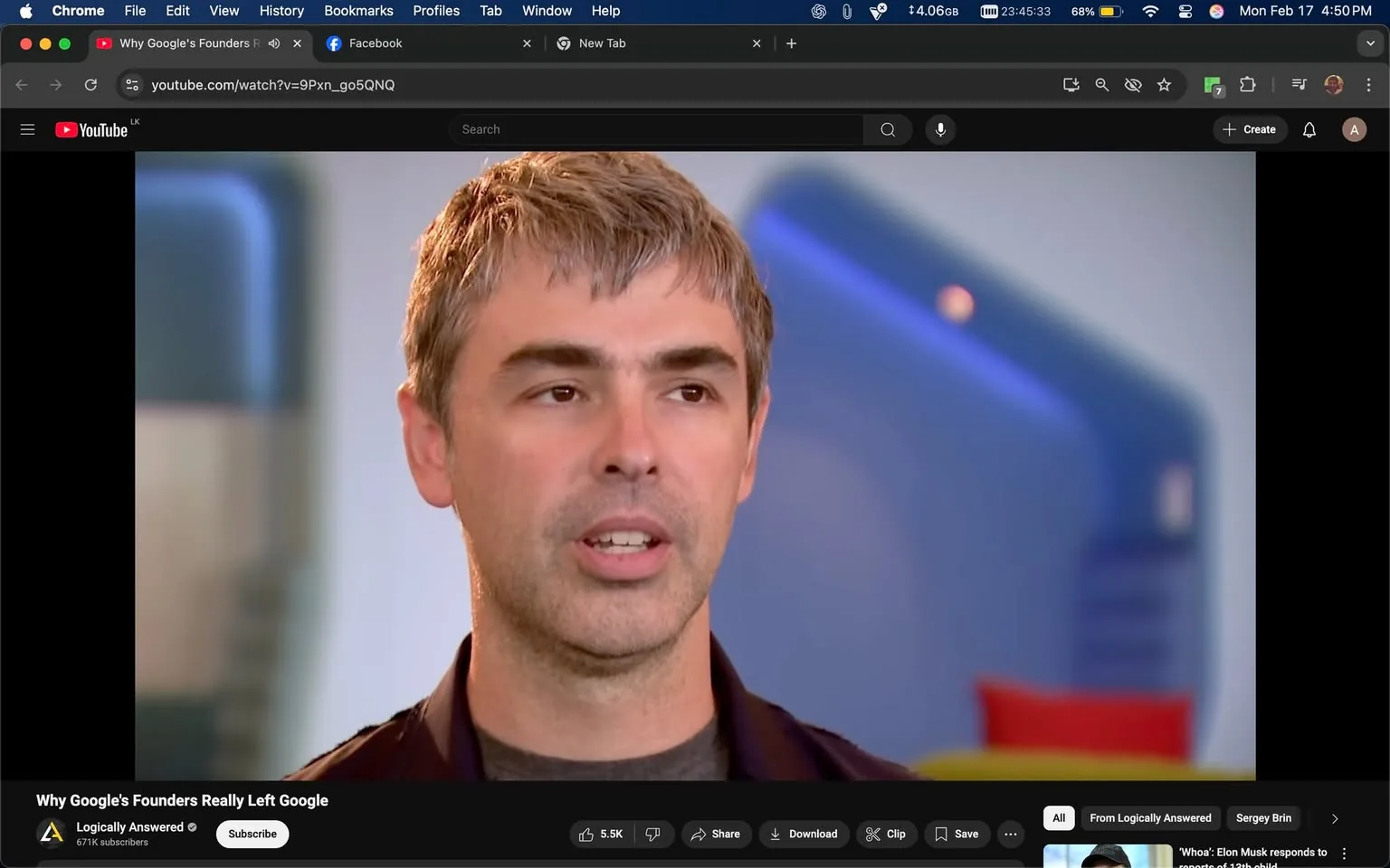 The image features a man with short, light brown hair styled in a slightly tousled manner. He has a fair complexion and is wearing a dark jacket over a gray shirt. His facial expression appears focused, and he is speaking, with his mouth slightly open as if in mid-sentence. The background is softly blurred, but hints of color can be seen, including blue and red elements, suggesting a modern, possibly corporate environment.

The setting appears to be an indoor space, likely an office or studio, with a clean and contemporary design. The lighting is bright, contributing to a professional atmosphere. There are no visible logos, text, or identifiable brands in the image.

The man is positioned centrally in the frame, with a slight angle to his body, suggesting engagement with an audience or interviewer. His gaze is directed slightly off-camera, indicating he is likely responding to a question or discussing a topic of interest. The overall composition of the image is focused on the subject, with minimal distractions in the background. 

No additional identifiable features or text are present in the image.