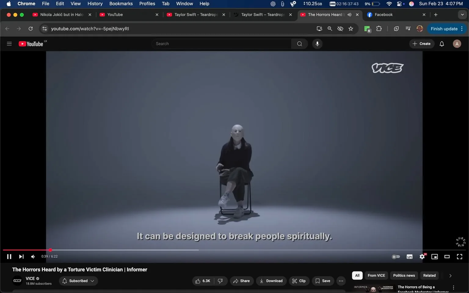 The image depicts a scene from a video on YouTube, specifically titled "The Horrors Heard by a Torture Victim Clinician | Informer" from the channel VICE, which has 18.8 million subscribers. The video is currently playing, with a timestamp indicating it is at 39 seconds into a total duration of 6 minutes and 22 seconds.

In the foreground, there is a figure seated on a simple black chair. The figure is wearing a black sweater over a white collared shirt, paired with dark trousers. The individual has a smooth, featureless white mask covering their face, which gives them an anonymous appearance. Their hair is long and dark, styled straight and hanging down past their shoulders. The figure's posture is relaxed, with one arm resting on their knee and the other hand holding what appears to be a small object or prop.

The background is minimalistic, featuring a gradient that transitions from a light gray at the top to a darker shade at the bottom, creating a stark contrast with the figure. The lighting is soft and even, contributing to the subdued atmosphere of the scene.

At the bottom of the screen, there is a subtitle that reads, "It can be designed to break people spiritually." This text is in white and is positioned centrally, indicating it is a direct quote from the figure in the video.

The YouTube interface is visible at the top and bottom of the image, showing various tabs and options such as "File," "Edit," "View," and others. The video controls, including play, pause, and volume settings, are located at the bottom of the screen, along with options to share, download, or save the video.

Overall, the image presents a stark and thought-provoking visual, emphasizing the anonymity of the figure and the serious nature of the content being discussed.