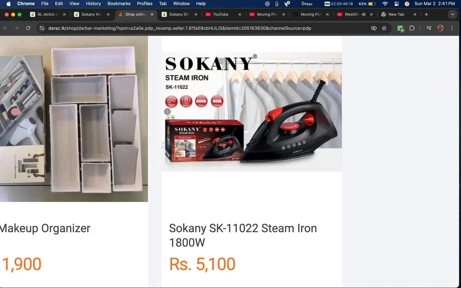 The image features two distinct products displayed side by side on a webpage. 

On the left side, there is a **Makeup Organizer**. It appears to be a multi-compartment storage solution designed for cosmetics. The organizer is predominantly white with various sections of different sizes, allowing for the storage of makeup items such as lipsticks, brushes, and other beauty products. The compartments are arranged in a grid-like pattern, with some sections being taller and narrower, while others are shorter and wider. The product is shown alongside its packaging, which includes a visual representation of the organizer in use.

On the right side, there is a **Sokany SK-11022 Steam Iron**. The iron is predominantly black with red accents. It features a sleek design with a pointed tip for precision ironing. The product is displayed in its packaging, which includes a box that has images of the iron and its features. The box indicates that the iron has a power rating of **1800W** and a water capacity of **190ml**. Below the product, the price is displayed as **Rs. 5,100**.

The background of the image is neutral, likely a light-colored surface that does not distract from the products. There are no visible people or additional elements in the image, focusing solely on the products being advertised. The overall layout is clean and organized, typical of an online shopping interface.