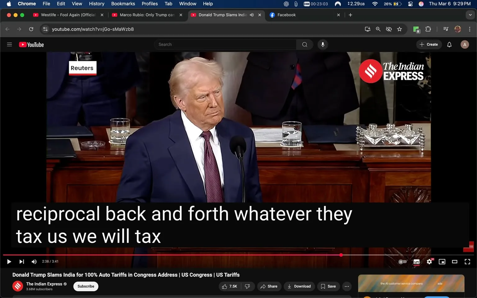 The image depicts a scene from a video, likely a congressional address, featuring a man with light-colored hair and a serious expression. He is wearing a dark suit with a white shirt and a red tie. The man appears to be speaking into a microphone positioned in front of him. His facial expression is focused, and he seems to be engaged in delivering a statement or speech.

In the background, there are several individuals, though their faces are not clearly visible. One person is partially visible, wearing a dark suit and a white shirt, standing behind the speaker. The setting appears to be a formal legislative environment, likely within the U.S. Congress, indicated by the wooden podium and the arrangement of seats behind the speaker.

On the podium, there are several objects: a clear glass of water, a small stack of papers, and a decorative item that resembles a crystal or glass dish. The podium itself has a polished wooden finish, and there are intricate carvings on the side.

In the upper left corner of the image, there is a logo that reads "Reuters," indicating that this image may be sourced from a news outlet. Additionally, there is a watermark in the lower left corner that reads "The Indian Express," suggesting that this video or image may be associated with that publication.

At the bottom of the image, there is a caption that reads: "reciprocal back and forth whatever they tax us we will tax," indicating that the speaker is discussing trade or tariff policies. The video playback controls are visible at the bottom, showing that this is a still from a video, with a timestamp indicating it is 2 minutes and 38 seconds into the video.

Overall, the image captures a formal moment in a legislative setting, with a focus on the speaker and the context of a significant address.