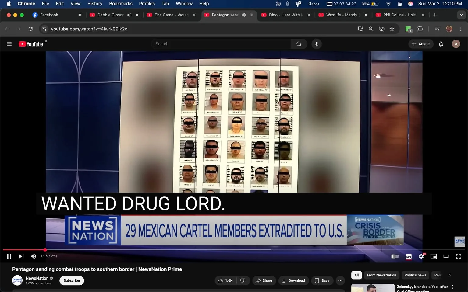 The image shows a news broadcast segment from a program titled "NewsNation Prime." The background features a blue and gray set design, with a large screen displaying a grid of photographs. The grid contains multiple headshots of individuals, all of whom have their eyes and mouths obscured by black bars, suggesting they are wanted individuals. The photographs are arranged in a 6x5 layout, with a total of 30 images visible.

At the bottom of the screen, there is a prominent text banner that reads "WANTED DRUG LORD." Below that, another banner states "29 MEXICAN CARTEL MEMBERS EXTRADITED TO U.S." This text is in a bold, sans-serif font, emphasizing the urgency of the news.

The overall color scheme of the broadcast is dark blue and white, creating a serious tone. The set appears to be well-lit, focusing attention on the displayed images. There are no visible people in the foreground, as the focus is entirely on the screen and the information being presented.

In the upper part of the screen, there are various browser tabs visible, including social media and music platforms, indicating that the image was captured from a computer or device displaying the news segment. The time displayed on the device is 12:10 PM, and the date is shown as March 2. The battery level is at 39%, and the internet connection shows a low speed indicator (0 Kbps).

The setting is clearly a digital news broadcast, likely related to crime or law enforcement, given the context of the images and text displayed.