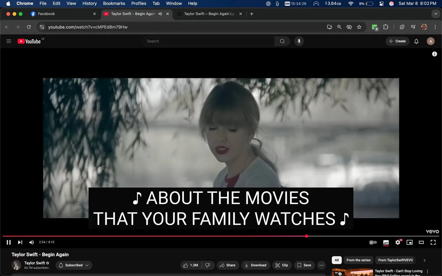 The image is a still from a music video featuring a female artist, who appears to be Taylor Swift. She is positioned slightly to the right of the frame, with her head tilted down and her eyes closed, suggesting a moment of introspection or emotion. Her hair is styled in soft waves, and she has a light blonde color. She is wearing a white cardigan over a red top, which contrasts with her pale skin. Her lips are painted a bold red, adding a pop of color to her appearance.

In the background, there are blurred elements that suggest a natural setting, possibly near a body of water, as indicated by the soft, diffused light and the presence of foliage. The background is somewhat out of focus, creating a dreamy atmosphere.

At the bottom of the image, there is a prominent text overlay with the lyrics: "♪ ABOUT THE MOVIES THAT YOUR FAMILY WATCHES ♪" The text is in a large, bold font, making it easily readable against the darker background. 

The video player interface is visible at the bottom, indicating that this is a YouTube video. The player shows that the video is 2 minutes and 54 seconds into a total duration of 4 minutes and 10 seconds. Below the video, there are various controls, including options to like, share, download, and clip the video. The channel name "Taylor Swift" is displayed, along with a subscriber count of 60.7 million, indicating the popularity of the artist.

Overall, the image captures a moment from a music video that combines elements of performance, emotional expression, and lyrical content, set against a serene natural backdrop.