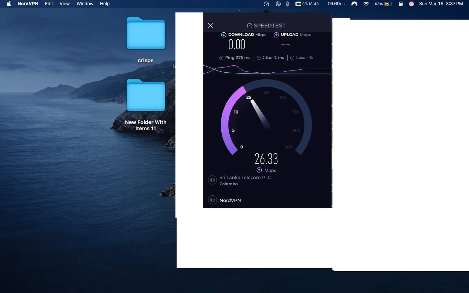 The image displays a computer screen with a background of a coastal landscape featuring mountains and water. The desktop has two blue folder icons labeled "crisps" and "New Folder With Items 11." 

On the right side of the screen, there is a speed test result displayed in a dark-themed interface. The speed test shows a download speed of 26.33 Mbps, with a ping of 275 ms, jitter of 2 ms, and no upload speed indicated (noted as "UPLOAD Mbps"). The service provider is listed as "Sri Lanka Telecom PLC," and the location is marked as "Colombo." The interface is branded with the NordVPN logo, indicating that the speed test was conducted while connected to this VPN service.

The time displayed in the top right corner of the screen reads "Sun Mar 16 3:37 PM," and the status bar shows various icons, including battery life, Wi-Fi signal strength, and a clock. The overall color scheme of the desktop is dark, with a gradient of blues and blacks, reflecting the coastal background.

No people are visible in the image, and there are no expressions or clothing to describe. The focus remains on the digital elements present on the screen.