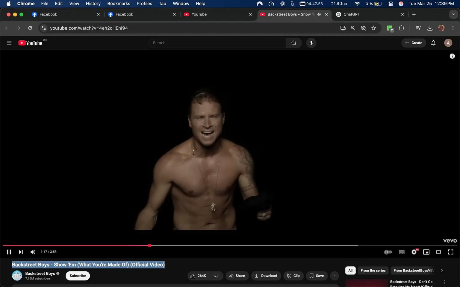 The image shows a scene from a music video featuring a male figure standing against a completely black background. The individual is shirtless, displaying a muscular physique. He has short, slightly tousled hair and is wearing a necklace with a small pendant. His facial expression is intense, with his mouth open as if he is singing or shouting. The lighting highlights his upper body, emphasizing his toned arms and chest.

In his right hand, he appears to be holding a black object, possibly a piece of clothing or a prop related to the performance. The background is devoid of any additional elements, focusing solely on the individual. There are no visible logos, trademarks, or text within the image itself.

The video is identified as "Backstreet Boys - Show 'Em (What You're Made Of) (Official Video)" and is currently playing at 1 minute and 17 seconds into a total duration of 3 minutes and 58 seconds. Below the video, there are options to subscribe, share, download, and save, along with a view count of 264,000. The video is hosted on YouTube, indicated by the logo in the top left corner.

Overall, the image captures a dynamic moment in a music video, emphasizing the performer's physicality and emotional expression against a stark, minimalist backdrop.