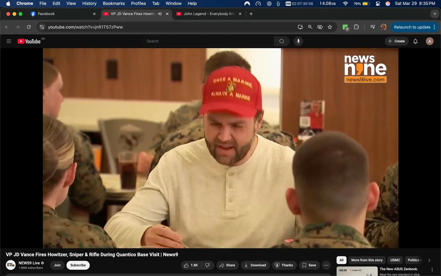 The image depicts a group of individuals seated at a table in a dining setting, likely within a military base or similar environment. 

**Foreground:**
- A man is prominently featured in the foreground, wearing a red baseball cap with the text "ONCE A MARINE, ALWAYS A MARINE" embroidered on it. He has a beard and is dressed in a light-colored long-sleeve shirt with buttons. His facial expression suggests he is engaged in conversation or possibly expressing a strong opinion.
- He is holding a fork in his right hand and appears to be eating from a plate in front of him.

**Background:**
- Two individuals are visible in the background, both wearing military uniforms. One is a woman with her hair styled in a bun, facing the man in the foreground. The other is a man with a shaved head, partially turned away from the camera.
- The setting includes wooden paneling on the walls, and there are several drinks, possibly soft drinks, on the table. The overall atmosphere seems casual and communal.

**Text and Logos:**
- The image contains a watermark in the top right corner that reads "news9" with the website "news9live.com" below it. This indicates that the image may be sourced from a news outlet.

**Environmental Context:**
- The dining area appears to be well-lit, with a modern design featuring wooden elements. The presence of military personnel suggests that this could be a gathering related to military activities or events.

Overall, the image captures a moment of interaction among individuals in a military dining context, with a focus on the man wearing the distinctive cap.