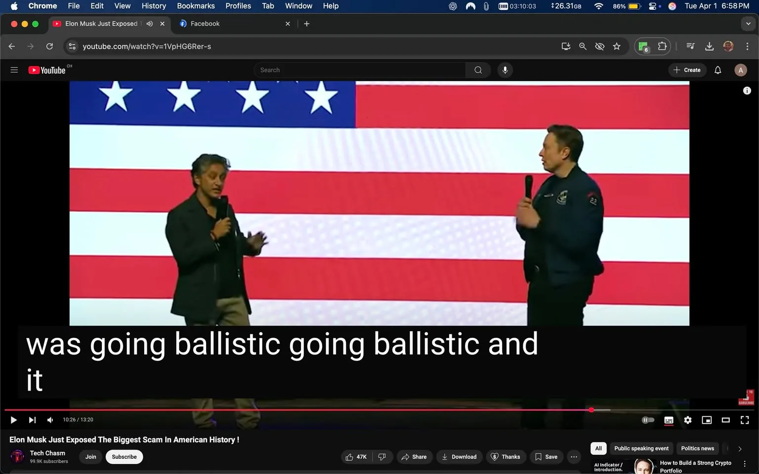 The image depicts a scene from a video presentation featuring two individuals standing on a stage. The background consists of a large American flag, prominently displaying red and white stripes with blue sections containing white stars. 

On the left, one person is wearing a black blazer over a black shirt, with light-colored pants. He has dark, wavy hair and is holding a microphone in his right hand. His facial expression appears animated as he gestures with his left hand while speaking.

On the right, the second individual is dressed in a dark blue jacket, which has a logo on the left side of the chest. He is also holding a microphone in his right hand and is facing the other person, seemingly engaged in conversation. His hair is short and light-colored.

The video interface at the bottom shows a timestamp indicating 10:26 of a 13:20 video, with subtitles visible that read, "was going ballistic going ballistic and it." The video is titled "Elon Musk Just Exposed The Biggest Scam In American History!" and is uploaded by a channel named "Tech Chasm," which has 99.9k subscribers. Below the video, there are options to join, share, download, and subscribe.

The overall setting appears to be a public speaking event, likely focused on technology or business, given the context of the individuals and the title of the video. The lighting is bright, emphasizing the speakers against the flag backdrop.