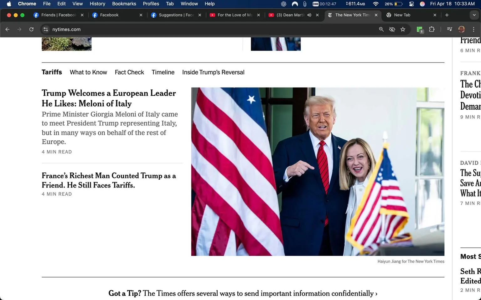The image features a scene from a news article on the New York Times website. The main focus is on two individuals standing together in front of a backdrop that includes two large flags: one American flag and one Italian flag. 

On the left side of the image, the American flag is prominently displayed, with its red and white stripes and blue field with white stars. The Italian flag is partially visible, suggesting a connection to Italy.

The first individual, on the right, appears to be a man with light skin, short, styled hair, and a slight smile. He is wearing a dark suit with a white shirt and a red tie. His body language is open, and he is gesturing with his right hand, possibly pointing or emphasizing a point. 

The second individual, on the left, has light skin and long, straight hair that falls past her shoulders. She is wearing a light-colored coat and has a cheerful expression, smiling broadly. She stands close to the man, suggesting a friendly interaction.

The background consists of a white wall and a window, indicating an indoor setting, likely a formal meeting space. The overall atmosphere appears to be positive, with both individuals engaged in conversation or a photo opportunity.

Above the image, there is text that reads "Trump Welcomes a European Leader He Likes: Meloni of Italy," indicating the context of the meeting. Below this headline, there is a brief description stating that Prime Minister Giorgia Meloni of Italy came to meet President Trump representing Italy, but also on behalf of the rest of Europe. 

The article is categorized under the "Tariffs" section, with additional headlines visible on the left side of the image, including topics related to tariffs and international relations. The layout suggests a typical news article format, with a focus on current events and political interactions. 

Overall, the image captures a moment of diplomatic engagement between the two leaders, set against a backdrop of national symbols.