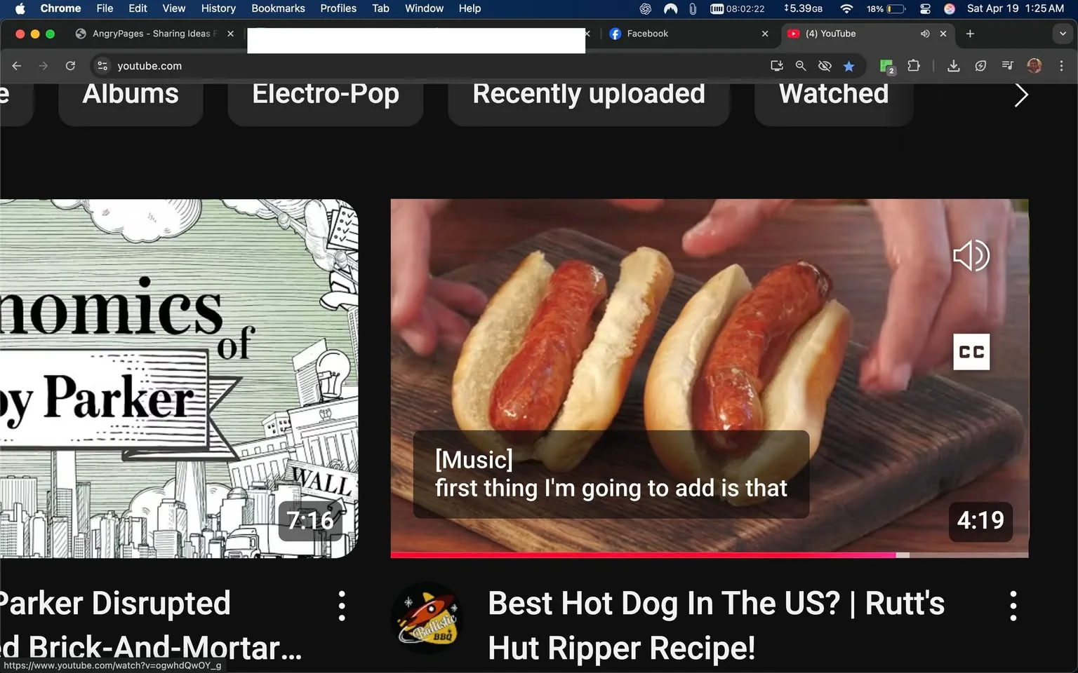 The image displays a YouTube interface featuring two main video thumbnails. 

1. **Top Thumbnail**: 
   - The title reads "Economics of [name] Parker" with the word "Parker" prominently displayed. 
   - The background is illustrated with a light green color and various cityscape elements, including buildings and clouds. 
   - The video duration is indicated as "7:16" in the bottom right corner.

2. **Bottom Thumbnail**: 
   - This video is titled "Best Hot Dog In The US? | Rutt's Hut Ripper Recipe!" 
   - The thumbnail shows two hot dogs placed in soft, light-colored buns on a wooden surface. 
   - A pair of hands is seen adding an ingredient to one of the hot dogs, with the sausage appearing reddish-brown and glossy. 
   - The video duration is "4:19," located in the bottom right corner. 
   - There is a caption overlay that reads "[Music] first thing I'm going to add is that," indicating audio content.

3. **Background and Interface**: 
   - The overall interface is dark-themed, typical of YouTube's dark mode. 
   - At the top, there are browser tabs showing "AngryPages - Sharing Ideas For..." and "youtube.com." 
   - The time displayed on the top right corner indicates "Sat Apr 19 1:25 AM," and there are icons for notifications and other functionalities.

4. **Surrounding Context**: 
   - Below the video thumbnails, there are various text snippets that appear to be lyrics or poetic lines, discussing themes of movement, existence, and personal challenges. 
   - The text is formatted in paragraphs, suggesting a conversational or lyrical context, possibly related to a song by Switchfoot titled "Dare You To Move."

Overall, the image captures a digital media browsing experience, focusing on food-related content alongside lyrical reflections.