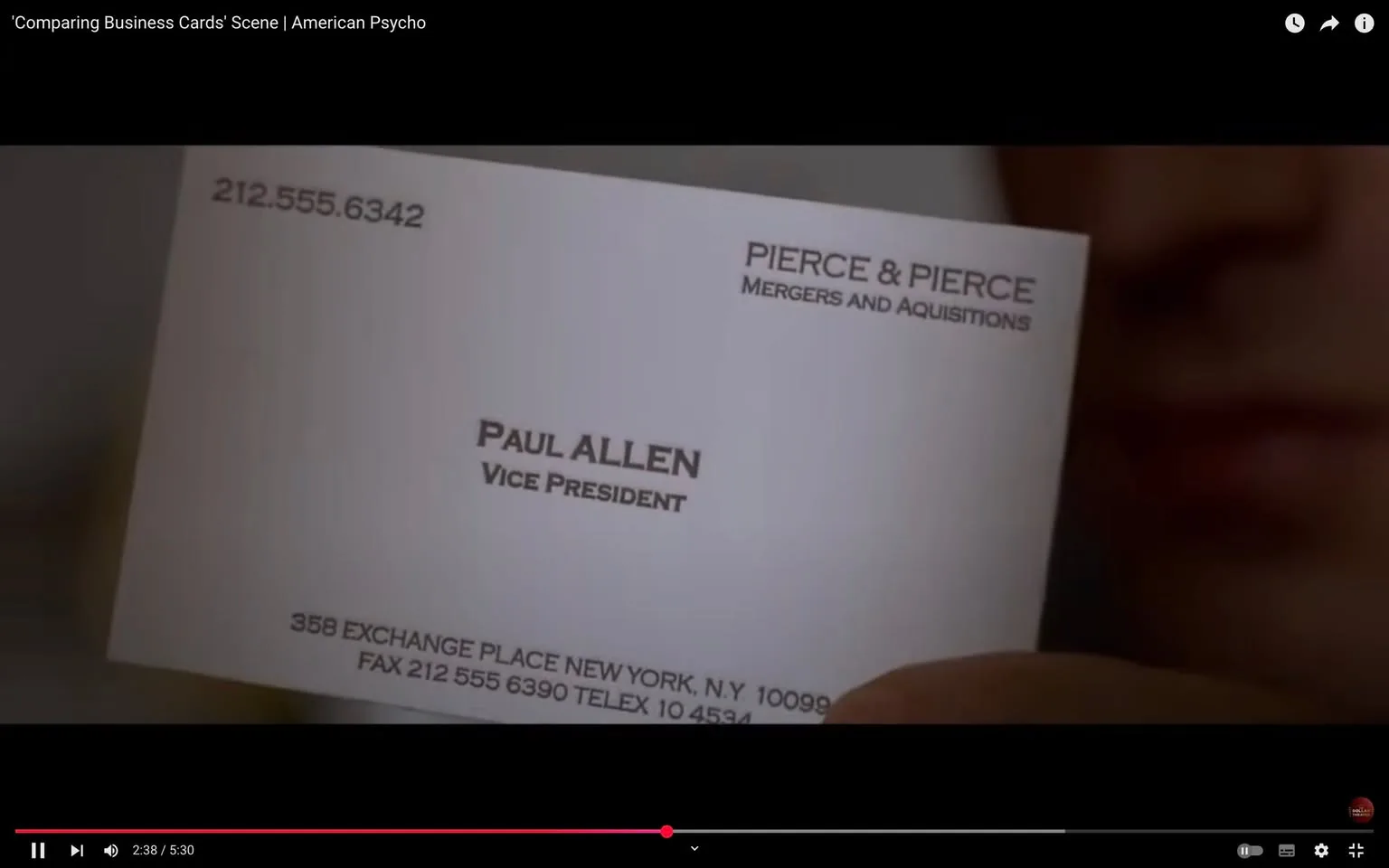 The image shows a close-up of a business card held in a person's hand. The card is predominantly white with black text. 

At the top left corner, there is a phone number formatted as "212.555.6342." Below that, the name "PIERCE & PIERCE" is printed in bold, uppercase letters, followed by the phrase "MERGERS AND ACQUISITIONS" in a smaller font. 

In the center of the card, the name "PAUL ALLEN" is prominently displayed in larger, bold text, with the title "VICE PRESIDENT" directly underneath it in a smaller font. 

At the bottom of the card, there is an address that reads "358 EXCHANGE PLACE NEW YORK, N.Y. 10099." Below the address, there are additional contact details: "FAX 212 555 6390 TELEX 10 4564."

The background of the image is blurred, but it appears to be an indoor setting, possibly an office or a meeting space. The hand holding the card is partially visible, and the person's face is slightly blurred in the background, suggesting they are focused on the card. The lighting is soft, creating a subtle contrast between the card and the background. 

Overall, the image captures a moment that emphasizes the details of the business card, highlighting the professional context it represents.
