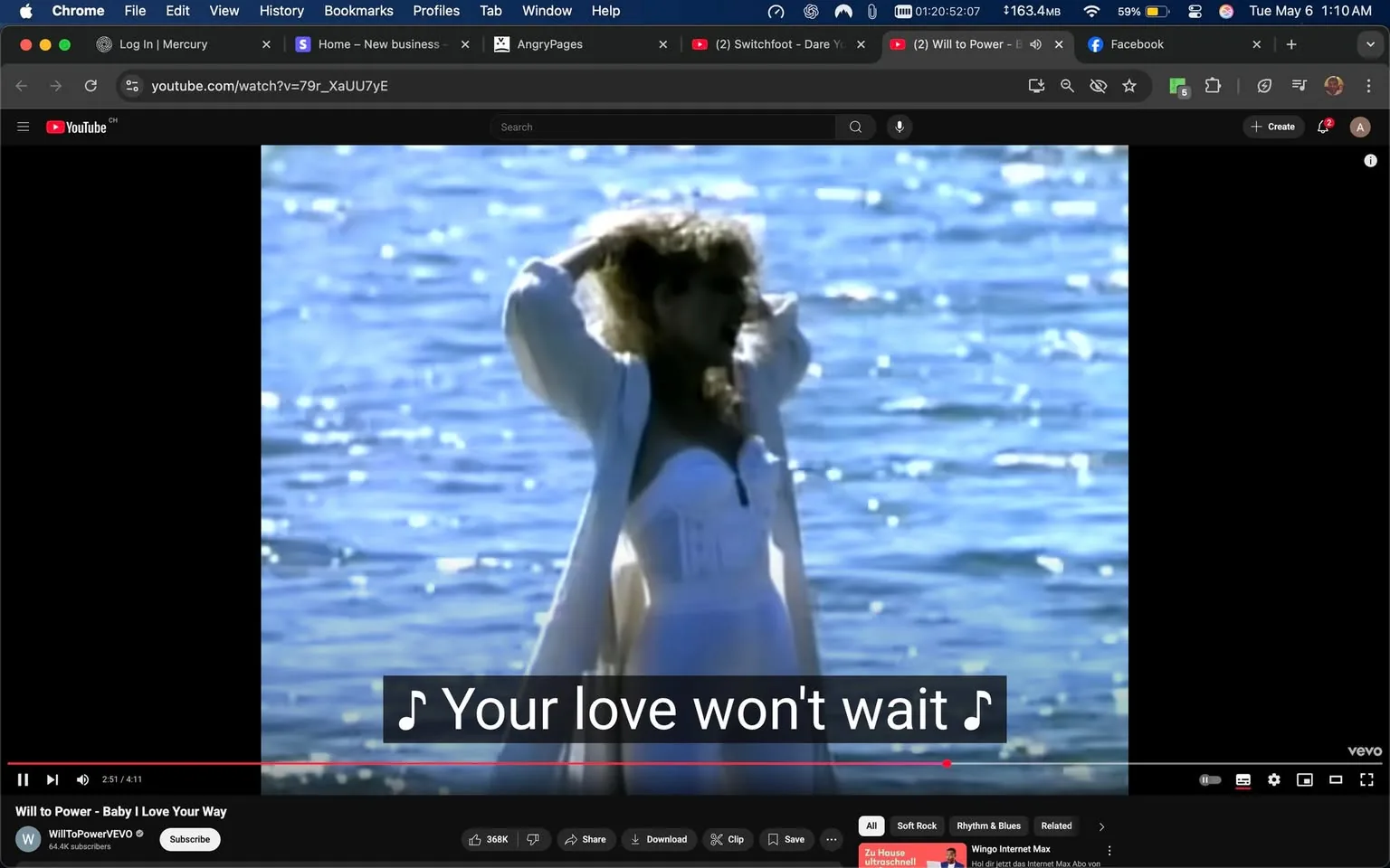 The image depicts a scene from a music video, specifically from the song "Baby I Love Your Way" by Will to Power. In the foreground, a woman stands in shallow water, with her back partially turned towards the camera. She has long, wavy hair and is wearing a white strapless dress that appears to be fitted at the bodice and flows downwards. The dress has a slight sheen, reflecting the sunlight. Over the dress, she is wearing a light, flowing white cover-up that drapes around her shoulders.

The background features a body of water, which is shimmering with reflections of sunlight, creating a sparkling effect on the surface. The water appears calm, and the overall color palette is bright, with blues and whites dominating the scene. The lighting suggests it is daytime, likely during golden hour, given the warm tones.

At the bottom of the image, there are subtitles that read, "Your love won't wait," indicating the lyrics of the song being played. The video interface shows the title of the song and the artist's name, along with the YouTube logo and other standard video controls, such as play, pause, and volume settings. The video is approximately 2 minutes and 51 seconds into a total length of 4 minutes and 11 seconds.

There are no visible logos or trademarks other than the YouTube branding. The overall mood of the scene appears to be romantic and nostalgic, fitting the theme of the song. The woman’s pose, with her hands in her hair, suggests a carefree or emotional expression, although her facial expression is not clearly visible due to the angle. The setting is serene, emphasizing the connection between the subject and the natural environment.
