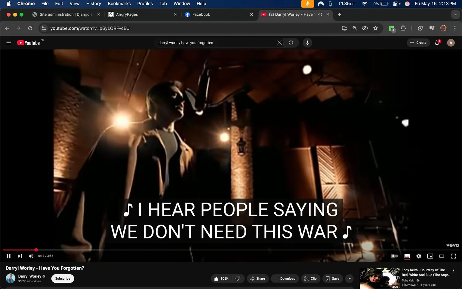 The image depicts a scene from a music video featuring a male singer performing. He is positioned in front of a microphone, with a spotlight illuminating him from the left side. The singer is wearing a dark, fitted shirt and a light-colored jacket. His hair is short and styled, and he appears to be focused on his performance, with a slight tilt of his head towards the microphone.

In the background, there are wooden panels and a brick wall, suggesting an indoor setting, possibly a recording studio or a performance venue. The lighting is warm, with soft spots creating a dramatic effect around the singer. There are also visible soundproofing panels on the wall, indicating a professional audio environment.

At the bottom of the image, there is a YouTube video interface. The title of the video is "Darryl Worley - Have You Forgotten?" displayed prominently. Below the title, the channel name "Darryl Worley" is shown, along with a subscriber count of 95.2K. There are also buttons for "Subscribe," "Share," "Download," and "Save," indicating user interaction options.

The video progress bar shows that the video is at 17 seconds out of a total length of 3 minutes and 56 seconds. Lyrics are displayed in large, bold text across the bottom of the image, reading: "I HEAR PEOPLE SAYING WE DON'T NEED THIS WAR." The overall atmosphere is one of a musical performance, with a focus on the singer and the emotional delivery of the song.