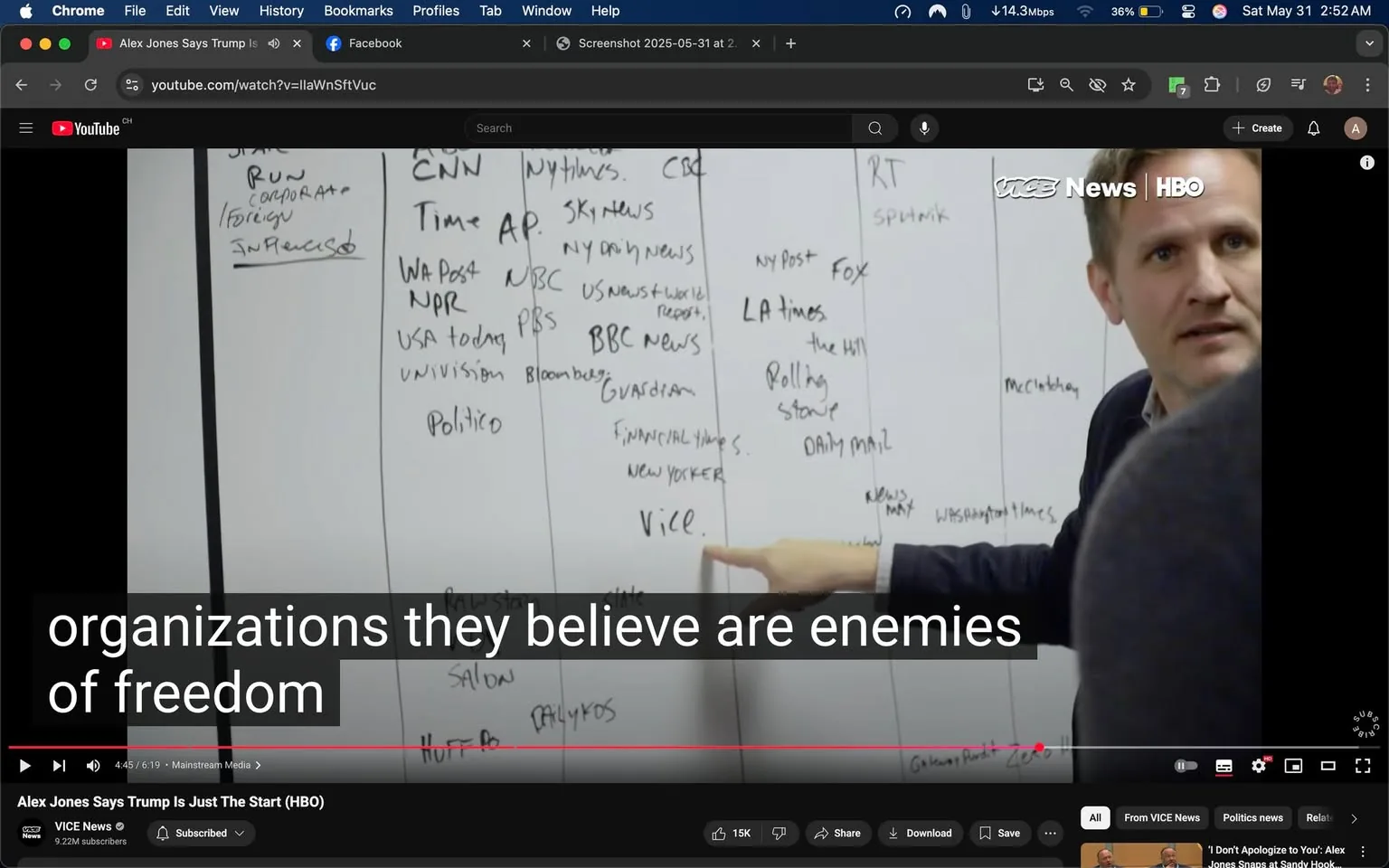 The image shows a man pointing at a whiteboard filled with handwritten text. The man is wearing a dark blazer over a light-colored shirt. He has short, slightly tousled hair and is looking directly at the camera with a serious expression. The whiteboard is divided into several columns, each containing a list of names, presumably of media organizations or news outlets. 

The visible text includes names such as "CNN," "Time," "AP," "NPR," "USA Today," "Politico," "The Guardian," "Vice," "Financial Times," and "New Yorker," among others. Some names are crossed out or have additional notes beside them. The columns appear to categorize these organizations, possibly indicating a viewpoint about their credibility or stance on certain issues.

In the background, there are no distinct features or objects that provide additional context about the setting. The environment appears to be an indoor space, likely an office or meeting room, given the presence of a whiteboard and the formal attire of the individual. 

The bottom of the image features a caption that reads, "organizations they believe are enemies of freedom," indicating the context of the discussion or presentation taking place. The video player interface is visible at the bottom, showing that this image is a screenshot from a YouTube video titled "Alex Jones Says Trump Is Just The Start (HBO)" from VICE News. The view count and other video-related information are also displayed. 

Overall, the image captures a moment of discussion regarding media organizations, with a focus on the man's presentation and the content of the whiteboard.