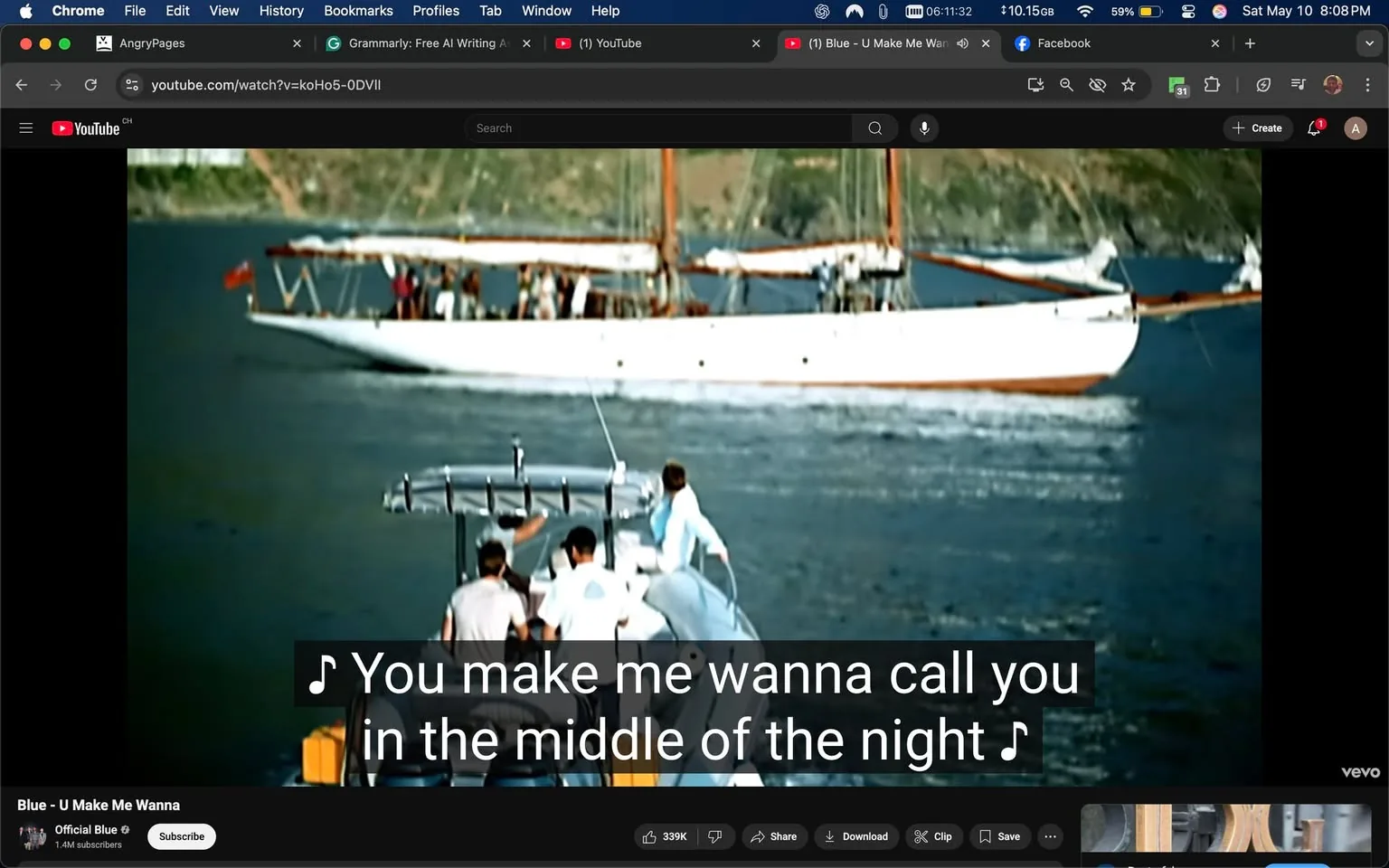 The image depicts a scene from a video, likely a music video, featuring a group of individuals on a small boat. The boat is positioned in the foreground, with three people visible on it. Two of them are wearing white shirts, while the third person is dressed in a gray shirt. They appear to be engaged in some activity, possibly steering or observing the surroundings. The boat has a console with a steering wheel and several controls visible.

In the background, there is a larger sailing vessel, which is white with wooden accents. This boat has multiple masts and appears to be carrying several passengers, as indicated by the presence of people on its deck. The water is calm, reflecting the boats and surrounding landscape, which includes green hills or cliffs in the distance.

The bottom portion of the image features subtitles with the text: "You make me wanna call you in the middle of the night," indicating that this is a music video. The video is hosted on YouTube, as evidenced by the interface visible at the top of the image, which includes the YouTube logo and navigation options.

The overall setting appears to be a coastal or maritime environment, likely during daytime, given the brightness and clarity of the scene. The colors are vibrant, with blues from the water and sky, and greens from the hills, contributing to a lively atmosphere. There are no visible logos or trademarks on the boats or individuals. The focus remains on the people and the boats, with no additional objects or products present in the scene.