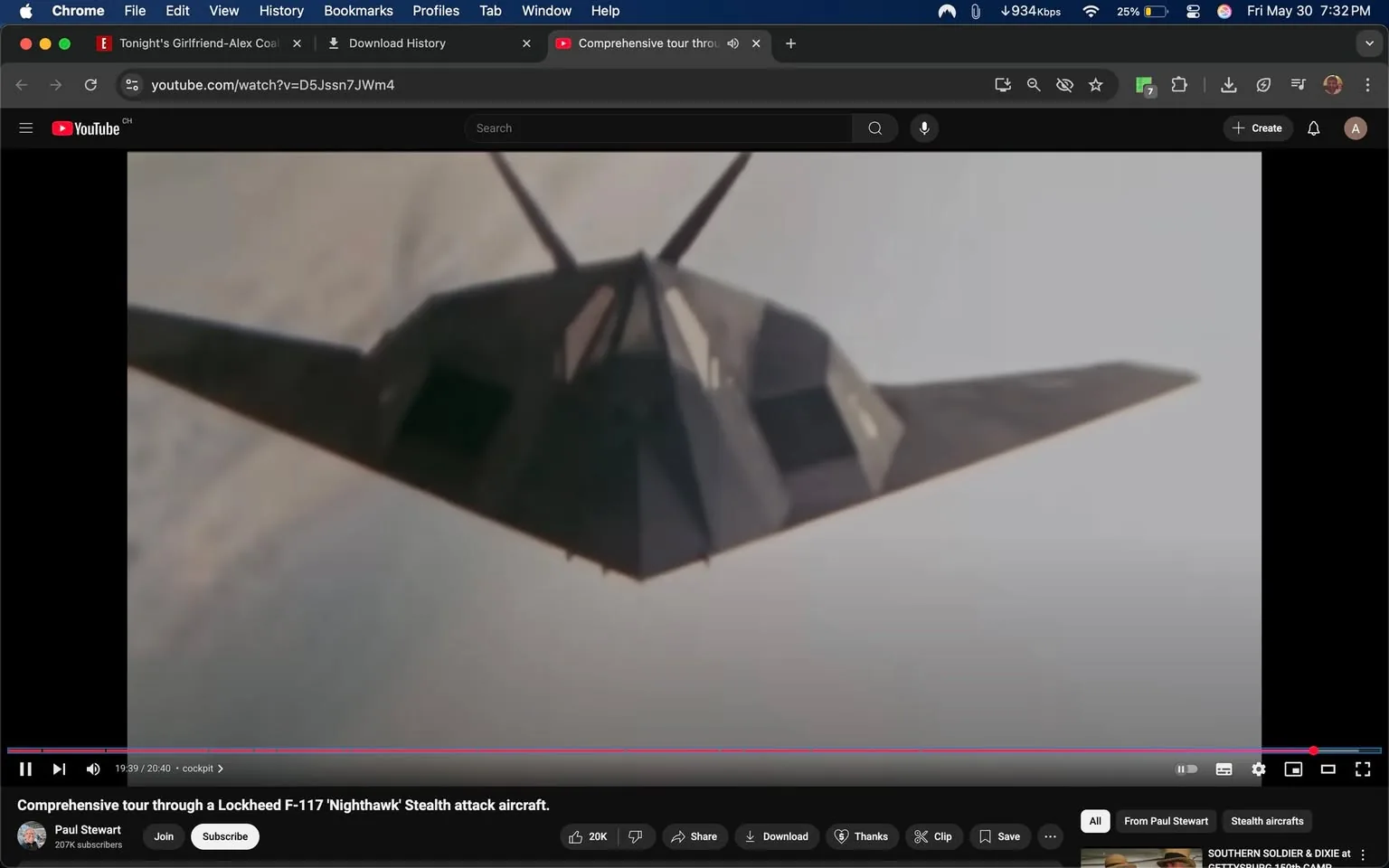 The image depicts a Lockheed F-117 Nighthawk stealth attack aircraft, prominently shown from a low angle as it appears to be flying. The aircraft features a distinctive angular design with a dark, matte finish that enhances its stealth capabilities. The wings are sharply pointed and extend outward, giving it a triangular silhouette. The body of the aircraft has several flat surfaces and sharp edges, characteristic of stealth technology, which minimizes radar visibility.

In the background, there are soft, cloudy skies, suggesting the aircraft is in flight at a high altitude. The lighting appears to be natural, possibly indicating daytime, with a slight overcast that diffuses the sunlight.

There are no visible people, text, or logos in the image. The focus remains solely on the aircraft, which is the central subject. The overall composition emphasizes the aircraft's unique design and stealth features without any distractions from other objects or elements in the scene. 

The video player interface at the bottom shows that this image is part of a YouTube video titled "Comprehensive tour through a Lockheed F-117 'Nighthawk' Stealth attack aircraft," hosted by a user named Paul Stewart, who has 207K subscribers. The video is currently at the timestamp of 19:39 out of a total of 20:40 minutes. The interface includes options to like, share, download, and comment, but no additional text or images are present in the surrounding area.