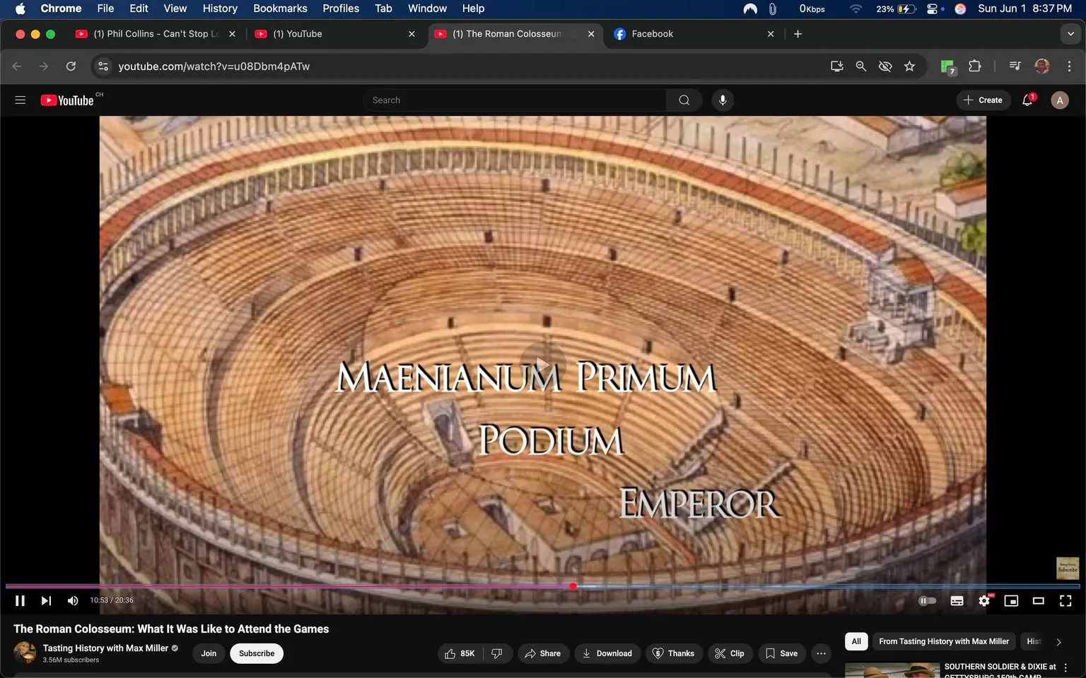 The image depicts a digital illustration of a Roman amphitheater, resembling the Colosseum. The structure is circular with multiple tiers of seating, showcasing a detailed arrangement of wooden benches. The arena is empty, with a sandy floor visible in the center, surrounded by the seating areas. 

In the foreground, there are three lines of text displayed prominently: "MAENIANUM PRIMUM," "PODIUM," and "EMPEROR." The text is in a large, serif font, with a white color that contrasts against the background, making it easily readable. The words are centered within the image, suggesting a focus on the hierarchical seating arrangement in the amphitheater.

The background features a detailed depiction of the amphitheater's architecture, including arches and columns, with a slight perspective that emphasizes its grandeur. The upper part of the structure has a series of openings, possibly for light or ventilation, and there are hints of surrounding buildings or structures in the distance, although they are less defined.

The overall color palette consists of warm tones, primarily browns and yellows, which give the illustration a historical and ancient feel. The image appears to be part of a video presentation, as indicated by the YouTube interface at the bottom, which includes a play bar, video duration, and viewer interaction options such as "Share," "Download," and "Thanks." The video title, "The Roman Colosseum: What It Was Like to Attend the Games," is also visible in the interface, suggesting the educational context of the illustration. 

No people or specific brands are present in the image, and the focus remains solely on the architectural representation of the amphitheater and the accompanying text.