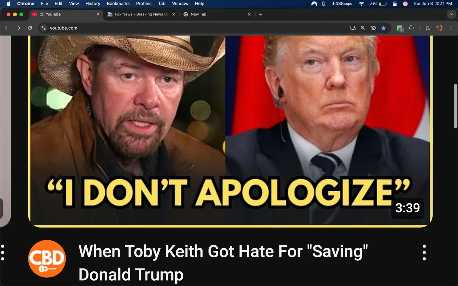 The image features two prominent figures side by side. On the left, a man with a rugged appearance is wearing a cowboy hat and a brown jacket. He has facial hair, including a mustache and goatee, and appears to be speaking or expressing a strong emotion, as indicated by his serious facial expression. The background behind him is blurred, suggesting an outdoor or casual setting with soft lighting.

On the right, a man with a distinct hairstyle is wearing a dark suit and a light blue tie. He has a serious expression, with his lips pressed together and his gaze directed slightly off-camera. The background behind him is a solid color, possibly red, which contrasts with his attire.

In the center of the image, there is bold text that reads, "I DON'T APOLOGIZE," in large yellow letters, which stands out against the darker background. Below the images, there is additional text that states, "When Toby Keith Got Hate For 'Saving' Donald Trump," indicating the context of the content. The video duration is displayed as "3:39."

The overall layout suggests this is a thumbnail for a video, likely related to a discussion or commentary involving the two figures mentioned. The branding at the bottom left features an orange circle with a guitar icon, indicating it may be associated with a music or entertainment platform.