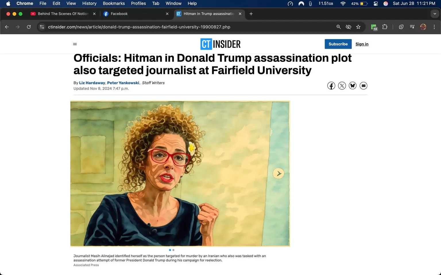 The image features a news article from CT Insider with the headline: "Officials: Hitman in Donald Trump assassination plot also targeted journalist at Fairfield University." The article is authored by Liz Hardaway and Peter Yankowski, identified as staff writers. The update timestamp reads November 8, 2024, at 7:47 p.m.

In the accompanying photograph, a woman is depicted speaking passionately. She has curly hair styled in a voluminous manner and is wearing a dark blue top. Her facial expression is intense, with her mouth open as if she is making a strong point. She is gesturing with her right hand, which is raised and clenched into a fist, suggesting emphasis in her speech. The woman also wears large, round glasses with a pink frame. A small white flower is tucked behind her left ear.

The background of the image is a neutral-colored wall, possibly in an indoor setting such as an office or a conference room. The lighting appears bright, illuminating her face and highlighting her expression. There are no other identifiable objects or people in the background, keeping the focus on her.

The article's layout includes a small section at the bottom that identifies the source of the image as "Associated Press." There are no visible logos or trademarks in the image aside from the CT Insider branding at the top of the article. 

Overall, the image captures a moment of strong expression from the journalist, emphasizing the seriousness of the topic discussed in the article.