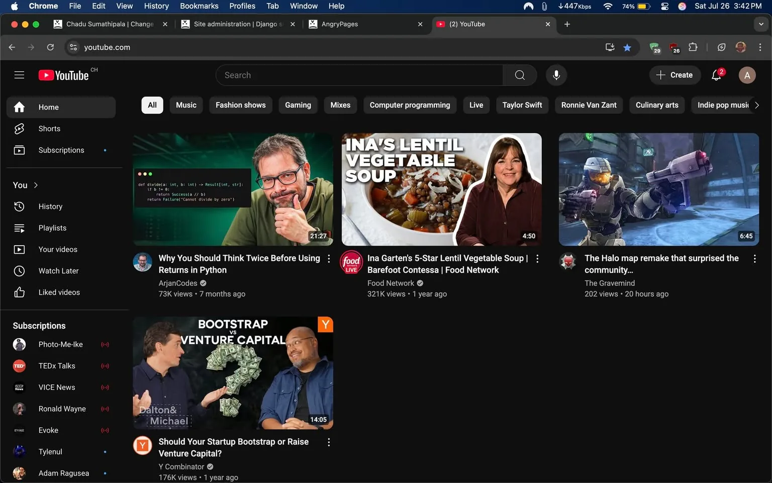 The image displays a screenshot of the YouTube homepage in dark mode. The layout features a sidebar on the left with options like "Shorts," "Subscriptions," "History," and "Playlists." The main content area showcases several video thumbnails.

1. **Top Video**: Titled "Why You Should Think Twice Before Using Returns in Python," it features a man with glasses and a beard, smiling and gesturing with his right hand. The video duration is 21:27. The background is green, suggesting a programming context.

2. **Second Video**: "Ina Garten's 5-Star Lentil Vegetable Soup" is presented with an image of a bowl of soup and a woman with shoulder-length hair, smiling. The video is from the Food Network and lasts 4:50.

3. **Third Video**: Titled "Should Your Startup Bootstrap or Raise Venture Capital?" features two men discussing, with one gesturing towards a graphic of money. The video duration is 14:05.

4. **Fourth Video**: "The Halo map remake that surprised the community..." shows a character in armor, likely from a video game, with a duration of 6:45.

The overall tone is informative and engaging, with a mix of educational and entertainment content. The presence of recognizable brands like Food Network and Y Combinator suggests a diverse range of topics.