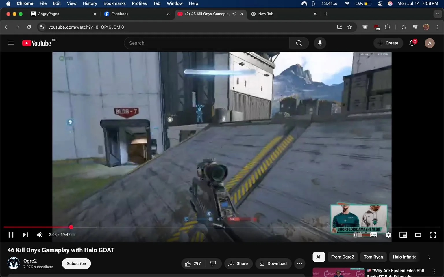 The image displays a gameplay video from a YouTube channel titled "Ogre2," featuring a first-person shooter scene from "Halo Infinite." The screen shows a character holding a weapon, positioned on a sloped surface with a yellow-striped path leading up. The environment is a futuristic, industrial setting with a white building labeled "BLDG - 7" prominently visible. 

In the background, mountains are visible under a clear blue sky, suggesting an outdoor map. The player’s HUD indicates health and ammo status, with a blue marker possibly representing a teammate or objective. The video is timestamped at 3:03 of a 19:47 total duration. 

The tone appears competitive and focused, typical of gaming content, with an emphasis on skill and strategy. There are no visible facial expressions or gestures, as this is a gameplay video. The context suggests a high-stakes gaming scenario, likely aimed at showcasing impressive gameplay, as indicated by the title "46 Kill Onyx Gameplay with Halo GOAT."