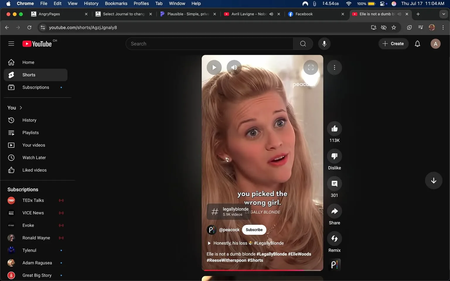 The image shows a scene from a YouTube Shorts video featuring a woman with blonde hair styled in soft waves. She has a surprised or assertive expression, with wide eyes and slightly parted lips, conveying a sense of confidence or indignation. She is wearing a light-colored top and a pearl necklace, which adds a touch of elegance to her appearance. 

The text overlay reads, "you picked the wrong girl," suggesting a moment of confrontation or empowerment. The video is tagged with #legallyblonde, indicating it is related to the film "Legally Blonde," which stars Reese Witherspoon as the character Elle Woods. The branding for Peacock is visible, suggesting the content may be affiliated with that streaming service.

The tone appears to be assertive and defiant, reflecting the character's strength. The composition emphasizes her facial expression, drawing the viewer's attention to her emotional state. There are no explicit or controversial elements in the image, but the context of the quote may resonate with themes of empowerment and challenging stereotypes.