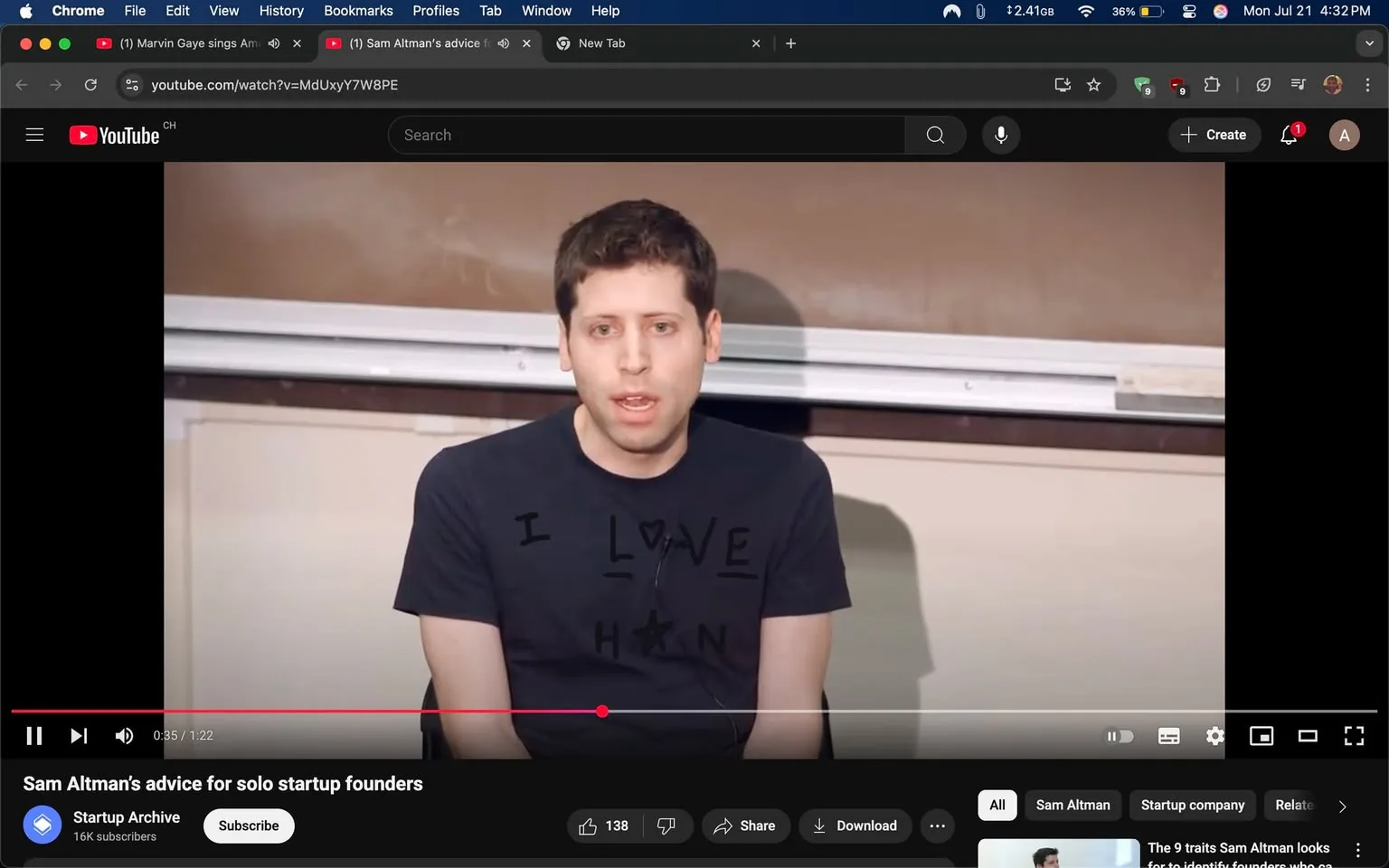 The image shows a man seated in front of a classroom setting, speaking directly to an audience. He has short, dark hair and is wearing a black t-shirt with the text "I LOVE H" printed on it, where the "O" is represented by a heart symbol. The background features a brown chalkboard and a whiteboard, suggesting an educational environment.

His facial expression is serious and focused, indicating he is engaged in a discussion or giving advice. His body language is open, with his hands resting on his knees, suggesting a relaxed yet attentive demeanor. The video title below indicates that he is sharing advice for solo startup founders, hinting at a motivational or instructive tone.

The bottom left corner displays the YouTube interface, including the video progress bar and viewer engagement metrics, such as "138" likes. The overall mood appears to be informative and supportive, aimed at aspiring entrepreneurs.