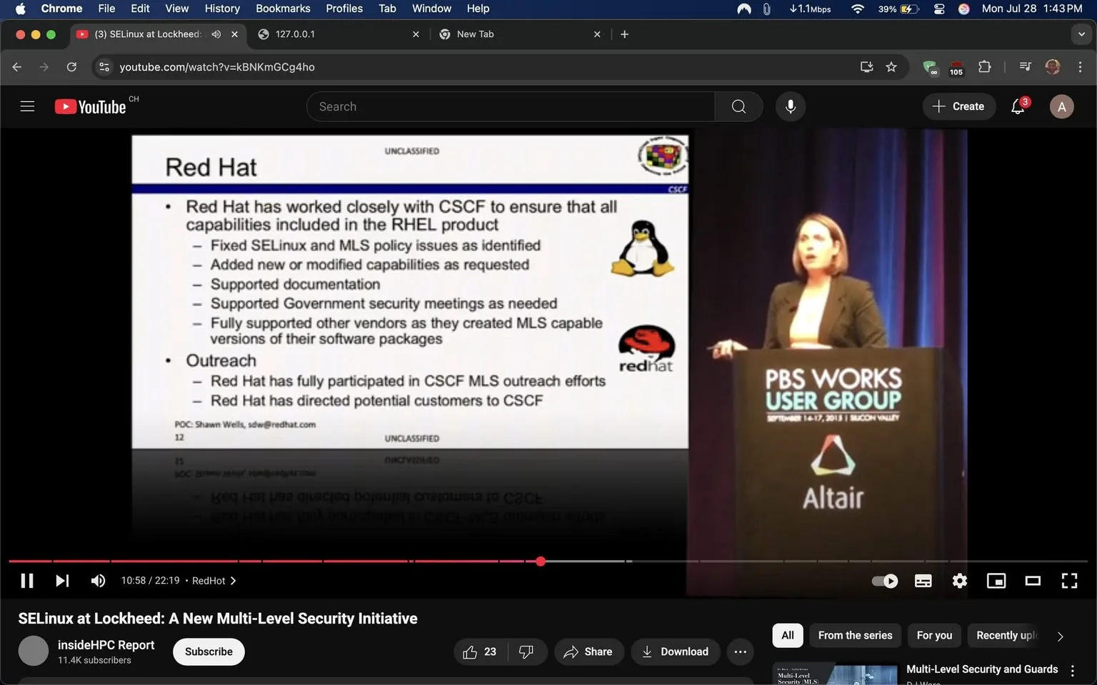 The image captures a moment from a presentation, likely at a conference or seminar, where a speaker is addressing an audience. The setting appears to be a professional environment, indicated by the formal attire of the speaker and the setup of the stage.

On the left side of the image, there is a slide titled "Red Hat," which outlines the company's collaboration with the CSCF (Common Security Configuration Framework). The slide is structured with bullet points detailing various contributions made by Red Hat, such as fixing SELinux and MLS policy issues, adding new capabilities, and supporting government security meetings. The slide is marked "UNCLASSIFIED," suggesting that the content is suitable for public dissemination. It features logos of both the Linux penguin and the Red Hat logo, which adds a visual element that emphasizes the focus on open-source software and security.

The speaker, a woman with shoulder-length hair, is positioned to the right of the slide. She is dressed in a black blazer over a light-colored top, projecting a professional and confident demeanor. Her body language suggests engagement and authority as she gestures with her right hand, likely emphasizing a point she is making. The audience is not visible, but the setting implies that she is addressing a group of professionals interested in technology and security.

The backdrop features the branding for "PBS WORKS USER GROUP," along with the dates of the event, September 14-17, 2015, and the location, Silicon Valley. This context hints at a gathering of individuals focused on advancements in technology, particularly in the realm of security and software solutions.

Overall, the image conveys a sense of professionalism and expertise, with the speaker actively engaging with her audience on important topics related to security initiatives in the tech industry. The combination of visual elements, such as the logos and the formal setting, reinforces the significance of the discussion taking place.