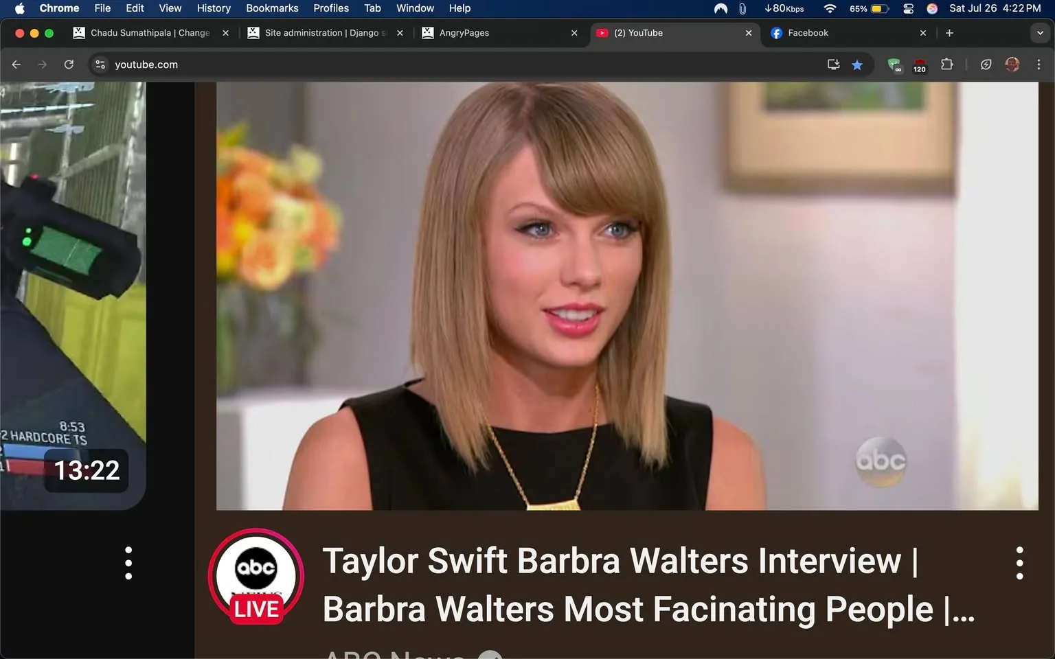 The image features a still from a video on YouTube, showcasing a segment titled "Taylor Swift Barbra Walters Interview | Barbra Walters Most Fascinating People." The video appears to be an interview segment, likely highlighting Taylor Swift, a well-known singer-songwriter, in conversation with the iconic journalist Barbra Walters.

In the foreground, Taylor Swift is the central figure. She has a polished appearance, with her hair styled in a sleek, straight bob that frames her face beautifully. Her makeup is subtle yet enhances her features, with a hint of blush and a soft pink lip color that adds warmth to her expression. She is wearing a black sleeveless dress that exudes elegance and sophistication, complemented by a delicate gold necklace that draws attention to her neckline.

Taylor's expression is engaging and animated, suggesting she is either sharing a personal story or responding thoughtfully to a question. Her blue eyes are bright and expressive, conveying a mix of confidence and sincerity. The background is softly blurred, focusing attention on her, while hints of a floral arrangement can be seen, adding a touch of warmth and color to the setting.

The video interface is visible on the left side of the image, showing a gameplay video alongside the interview segment. This juxtaposition creates an interesting contrast between the two types of content. The gameplay video appears to be from a first-person shooter game, indicated by the weapon and HUD elements visible on the screen. This side of the image is darker, with a timestamp showing "13:22," suggesting the length of the video or the current playback position.

The branding for the interview is prominently displayed at the bottom, with the ABC logo and the word "LIVE" highlighted in red, indicating that this content is from a live broadcast or a special feature. The overall tone of the image is professional yet approachable, capturing a moment of celebrity interaction that is both intimate and engaging.

This image encapsulates a moment where pop culture meets journalism, showcasing Taylor Swift in a setting that likely explores her life, career, and thoughts, while also appealing to a diverse audience that may include fans of both the artist and the interviewer. The combination of elements in the image creates a rich narrative, inviting viewers to delve into the conversation and the personalities involved.