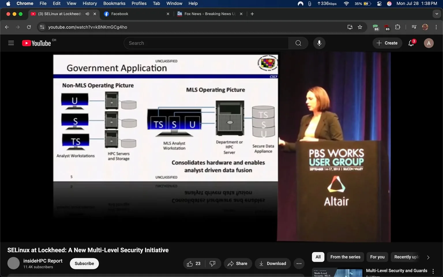The image captures a moment from a presentation, likely at a tech or security conference, given the context of the topic being discussed. On the left side, there is a detailed diagram titled "Government Application," which is divided into two sections: "Non-MLS Operating Picture" and "MLS Operating Picture." 

In the "Non-MLS Operating Picture," there are three types of workstations labeled "U," "S," and "TS," which likely represent different security classifications or access levels. These workstations are depicted alongside "HPC Servers and Storage," suggesting a focus on high-performance computing in a secure environment. 

The "MLS Operating Picture" section shows a more complex setup, featuring an "MLS Analyst Workstation," a "Department or HPC Server," and a "Secure Data Appliance." The diagram emphasizes the integration of these components, with arrows indicating data flow and the phrase "Consolidates hardware and enables analyst driven data fusion" prominently displayed. This suggests a focus on enhancing data analysis capabilities while maintaining security protocols.

To the right of the diagram, a woman stands at a podium, engaged in delivering her presentation. She appears confident and focused, gesturing towards the diagram as she explains the concepts. Her attire is professional, consisting of a dark blazer, which adds to the formal atmosphere of the event. The background features a gradient of dark colors, enhancing the visibility of the speaker and the presentation materials.

The podium is branded with the "PBS Works User Group" logo, indicating that this presentation is part of a larger event organized by PBS. The logo features a colorful triangular design alongside the name "Altair," suggesting a partnership or sponsorship. This branding adds a layer of credibility and professionalism to the presentation.

The overall tone of the image conveys a sense of seriousness and importance, reflecting the critical nature of the topics being discussed—multi-level security and data integration in government applications. The audience, though not visible in this frame, is likely engaged and attentive, given the complexity and relevance of the subject matter.

In summary, the image encapsulates a moment of knowledge sharing in a professional setting, highlighting the intersection of technology, security, and data analysis. The speaker's confident demeanor and the detailed diagram work together to communicate the significance of multi-level security initiatives in modern applications.