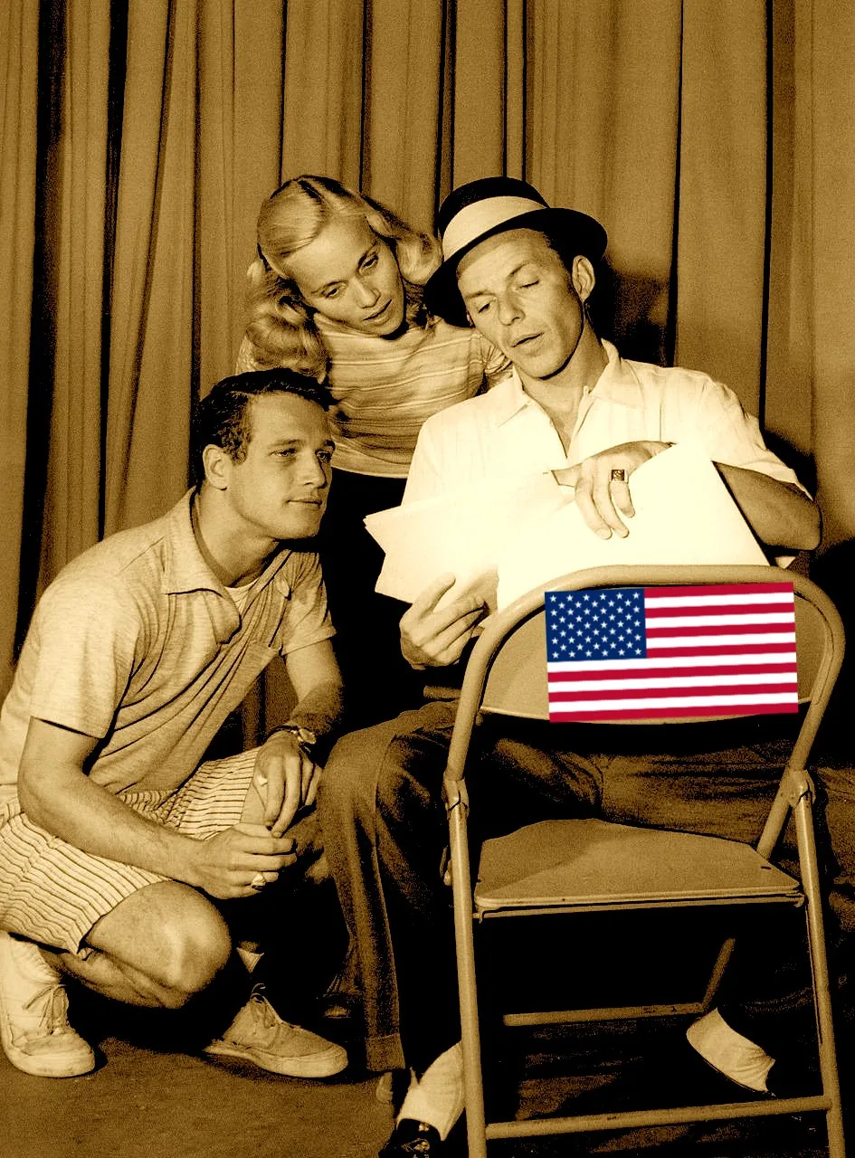 1) The image shows Frank Sinatra, Eva Marie Saint, and Paul Newman in a candid moment, likely during a rehearsal or discussion.

2) On-screen text block:
- Title: ""
- Channel / profile: ""
- Site / app: ""
- Captions / subtitles: ""

3) Three people are present, with one seated and two standing nearby, looking at papers. The setting appears to be indoors with a curtain backdrop, and a U.S. flag is visible on the chair. The image has a vintage sepia tone.