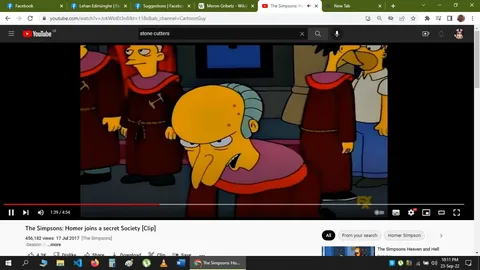 This screenshot captures a scene from "The Simpsons," specifically from a clip titled "The Simpsons: Homer joins a secret Society" on YouTube, hosted by the channel CartoonGuy. The backdrop is an animated setting depicting a secret society meeting, with several characters dressed in ceremonial robes. In the foreground, an older character with a hunched posture and a distinctive, elongated nose is prominently featured, wearing a red robe with a dark brown belt. Around him, other members of the society are similarly robed, suggesting a sense of unity and mystery.
To the right, a character who resembles Homer Simpson, a key figure from the show, is partially visible, adding to the comedic tone typical of the series. The mood is both secretive and humorous, highlighted by the exaggerated facial expressions and body language. The colors are vibrant, with the characters' robes standing out against the dimly lit room, enhancing the clandestine atmosphere. The video is published by FX, known for airing "The Simpsons," and the clip delves into the comedic antics of Homer as he becomes involved in this secretive group. The scene humorously portrays themes of conspiracy and secrecy within the show's satirical context.
- Title: "The Simpsons: Homer joins a secret Society [Clip]"
- Channel / profile: "CartoonGuy"
- Site / app: "YouTube"