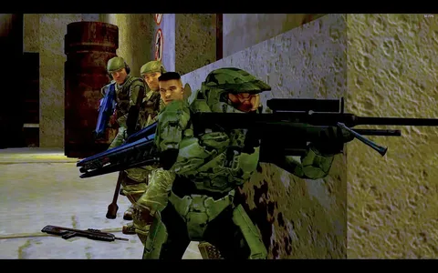 This image is a screenshot from a video game, specifically "Halo." It features a group of characters in a military setting, poised for action along a textured wall. The central figure is wearing a green armored suit, a characteristic outfit of the game's protagonist, Master Chief. He is holding a large, futuristic-looking weapon and appears to be leading the group. Three soldiers, dressed in camouflage uniforms and helmets, are seen behind him, each holding weapons and prepared for combat. The scene is set in a dimly lit, industrial environment with metal barrels and prohibition signs visible in the background, adding to the tense, strategic atmosphere. The lighting emphasizes the details on the characters' armor and weapons, suggesting a moment of anticipation before engagement. The visual style is typical of early 2000s video game graphics, with sharp edges and vibrant colors.