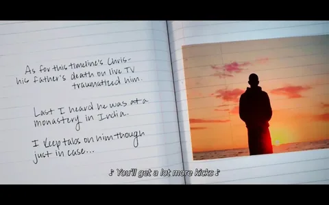 A screenshot shows an open notebook with handwritten text on the left page and a photograph on the right. The text discusses a character named Chris, mentioning his trauma after witnessing his father's death on live TV and that he's currently in a monastery in India. The writer keeps tabs on him. On the right page is a photo of a figure silhouetted against a sunset over the ocean, creating a serene yet somber mood. The sky is colored with hues of orange and pink, indicating either dawn or dusk. The visual composition suggests a reflective moment. A subtitle at the bottom reads, "♪ You'll get a lot more kicks ♪", adding an auditory element to the scene. The overall tone conveys themes of memory, trauma, and contemplation.