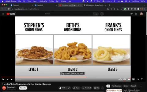 This image is a screenshot from a YouTube video titled "4 Levels of Onion Rings: Amateur to Food Scientist" on the Epicurious channel. The screenshot displays a comparison of three different types of onion rings labeled with the names Stephen, Beth, and Frank. Stephen's onion rings are identified as Level 1, Beth's as Level 2, and Frank's as Level 3. Each plate of onion rings is visually distinct, with Stephen's appearing crispy and golden-brown, Beth's being thicker and slightly more golden, and Frank's looking lighter in color. Accompanying sauces are visible next to each plate. The background is plain, drawing attention to the onion rings. The screenshot includes a subtitle reading "[light anticipatory music]," suggesting an engaging and lighthearted tone. The video is part of a series that explores different levels of cooking expertise, from amateur to expert.