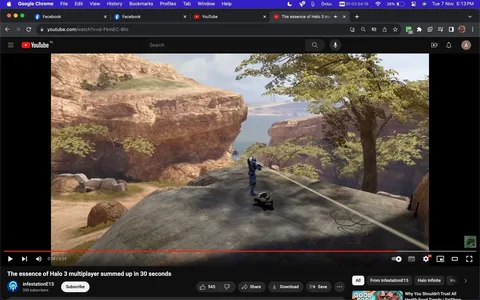 The screenshot shows a YouTube video titled "The essence of Halo 3 multiplayer summed up in 30 seconds" from the channel "infestationE15." The video appears to capture a scene from the game "Halo 3," specifically focusing on a moment in its multiplayer mode. In the foreground, a character clad in blue armor stands on a rocky outcrop, appearing to be in action or aiming. The background reveals a scenic landscape with rocky cliffs, trees, and a distant body of water, creating an immersive outdoor setting typical of "Halo 3's" expansive environments.
The YouTube interface is visible at the top and bottom of the screenshot, displaying tabs for open websites, such as Facebook and YouTube. The video has received 545 likes, and buttons for sharing and downloading are present, along with standard YouTube controls. The aesthetic reflects the game's mix of natural and futuristic elements, with detailed textures and lighting enhancing the realism of the environment. The presence of a comment count (20) and other interactive elements like the subscribe button suggest community engagement with the content.