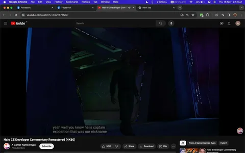 The image is a screenshot from a YouTube video titled "Halo CE Developer Commentary Remastered (4K60)" hosted on the channel "A Gamer Named Ryan." The video features commentary related to the game "Halo CE." In this particular frame, a character from the game is visible walking through a dimly lit corridor, likely part of the game's environment. The scene is bathed in dark and muted colors, with hints of blue and green lighting, creating a moody and atmospheric setting typical of sci-fi games like Halo.
The character appears to be in military attire, suggesting a connection to the game's storyline involving space marines. The on-screen subtitles read, "yeah well you know he is captain exposition that was our nickname," indicating a humorous commentary possibly about a character known for providing narrative exposition. The video is categorized under gaming and commentary, with a focus on remastered footage in high resolution, as emphasized by the "4K60" in the title. The layout includes standard YouTube player features like the subscribe button, video likes, share options, and viewer statistics.
