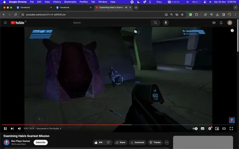 The screenshot captures a YouTube video titled "Examining Halo's Scariest Mission" from the channel "Ben Plays Games." It's a gameplay video featuring "Halo," a popular sci-fi first-person shooter game. The scene shows a player in a virtual environment, with a first-person perspective. The player holds a futuristic weapon, indicated by the ammo count and weapon display at the bottom right of the screen. A marine character is visible crouching near a large, purple alien structure. The setting is indoors, with a dim, metallic ambiance typical of sci-fi games, enhancing the eerie mood. The interface displays health and ammo stats at the top left. This video seems to explore a specific mission in the game known for its intense and scary moments. The YouTube interface is visible, showing options like share, download, and thanks. The video is paused at 9:28 out of an 18:18 runtime, and it has received 40K likes.
