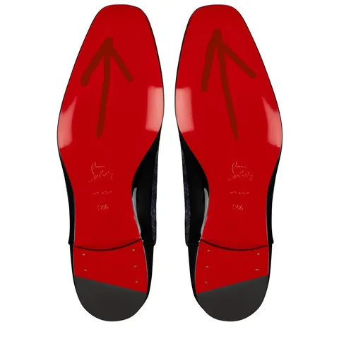 This image features the soles of a pair of designer shoes known for their signature red bottoms. The soles are bright red and have arrows pointing upwards on each sole. The distinctive style is synonymous with luxury fashion, specifically from a well-known designer brand. The soles are glossy with a shiny finish, indicating high-quality craftsmanship. There is text embossed on the soles, including the designer's name, "Christian Louboutin," which is a hallmark of this brand's footwear. The design is elegant and bold, capturing the essence of high fashion. The image presents a close-up view, focusing solely on the soles, emphasizing their iconic status in the fashion industry.