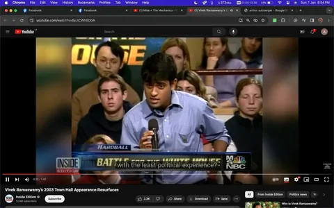 The video frame shows Vivek Ramaswarmy speaking into a microphone during a town hall event, depicted on MSNBC's "Hardball." Vivek is dressed in a blue shirt and appears to be addressing an audience seated closely around him. The setting is an indoor venue, with several people visible in the background, attentively listening to the discussion. The atmosphere suggests a formal or semi-formal political event, likely focused on political discourse and debate.
The bottom of the screen features text overlays with the show's branding, "BATTLE FOR THE WHITE HOUSE," and the MSNBC logo, indicating the event's theme and the broadcaster. Captions on the screen read, "with the least political experience?" implying a discussion or question about political experience, possibly directed at or involving Vivek. The lighting is standard for indoor television studio settings, bright enough to clearly see the participants and audience members.
- Title: "Vivek Ramaswamy's 2003 Town Hall Appearance Resurfaces"
- Channel / profile: "Inside Edition"
- Site / app: "YouTube"
- Captions / subtitles: "with the least political experience?"