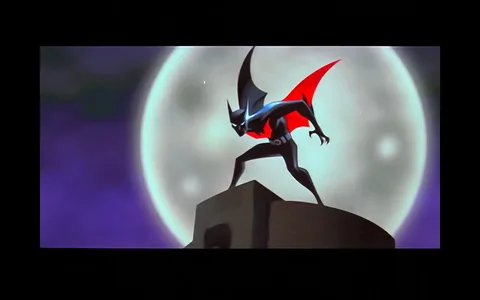 The image is an illustration from the animated series "Batman Beyond." It features the character Batman Beyond, shown in a dramatic pose atop a building. The character is positioned against a large, bright moon, creating a striking silhouette. The futuristic Batman's suit is sleek and black with red accents, including a red symbol on the chest. His cape is prominently shown, billowing in the wind, adding to the dynamic nature of the scene. The background is a deep purple, enhancing the nighttime setting and emphasizing the character's shadowy figure. The style is bold and stylized, typical of animated superhero series, with sharp lines and contrasting colors. The mood is tense and heroic, capturing the essence of action and mystery. The scene takes place at night, indicated by the moon and dark sky, suggesting a classic vigilante moment.
- Title: "Batman Beyond"