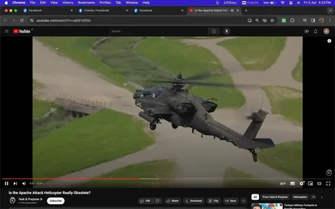 1) Rich description: The screenshot shows a YouTube video titled "Is the Apache Attack Helicopter Really Obsolete?" The video is from the channel "Task & Purpose," which appears to have 1.5 million subscribers. The video frame displays an Apache attack helicopter in flight, seemingly maneuvering over a green landscape with intersecting dirt paths. The helicopter is shown from the side, showcasing its rotors, weaponry, and streamlined design, painted in military green. The lighting suggests daytime, with clear visibility highlighting the helicopter's details. The YouTube interface is visible, with options to like, share, download, and save the video. The screenshot captures a paused video at 8:41 of the 20:47-minute duration. The scene is dynamic, emphasizing the helicopter's capabilities, and the video explores the topic of the helicopter's relevance in modern military contexts.
2) On-screen text block:
- Title: "Is the Apache Attack Helicopter Really Obsolete?"
- Channel / profile: "Task & Purpose"
- Site / app: "YouTube"