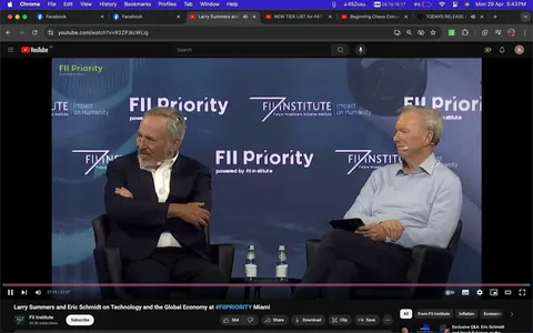 Larry Summers and Eric Schmidt are engaged in a discussion at an event titled "Larry Summers and Eric Schmidt on Technology and the Global Economy at #FIIPRIORITY Miami," held by the FII Institute. The setting is indoors, with a professional and formal atmosphere. Both individuals are seated on stage, with Larry Summers on the left and Eric Schmidt on the right. Larry Summers is wearing a dark suit with a white shirt, sitting with his arms crossed, appearing thoughtful and engaged in the conversation. Eric Schmidt is casually dressed in a light blue sweater, holding a tablet and looking attentive. The backdrop features the FII Institute's branding, including the phrases "FII Priority" and "Impact on Humanity," emphasizing the event's focus on significant global topics. The lighting is bright, spotlighting the speakers against the dark blue and white backdrop, creating a sharp contrast that highlights their presence on stage. The audience is not visible, keeping the focus on the speakers and their dialogue.
- Title: "Larry Summers and Eric Schmidt on Technology and the Global Economy at #FIIPRIORITY Miami"
- Channel / profile: "FII Institute"
- Site / app: "YouTube"