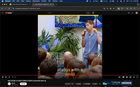 The image is a video frame from YouTube, featuring Sam Altman speaking at an event. The setting is indoors, with plants in the background and a colorful artwork on the wall. Sam Altman is holding a microphone, wearing a blue zip-up jacket over a t-shirt, and appears to be addressing an audience seated in front of him. The mood is informative and engaging, as he is likely sharing insights on building a successful start-up. The attendees are focused on him, creating a setting typical of a presentation or a talk. The video is titled "Sam Altman on what it takes to build a successful start-up" and is hosted on the YouTube channel "Misfits." The caption at the bottom of the screen reads "always with a small," suggesting this is part of a larger sentence or advice being given. The frame captures the interactive nature of such events, where ideas and experiences are shared with aspiring entrepreneurs.