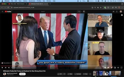 1) Rich description (8–12 sentences): The image shows a screenshot from a YouTube video on the channel "BlackConservative24" titled "Billionaire Finally Met Trump and Realized He Was Wrong About Him." The scene captures a moment where Donald Trump is engaged in conversation with a man and a woman, standing in front of an American flag backdrop. Donald Trump is wearing a dark suit with a striped tie, gesturing with his hands as he speaks. The man, presumably Chamath Palihapitiya based on the hint, is dressed in a black suit and appears to be listening attentively. The woman has long dark hair and is wearing a sleeveless dress. In the background, a split-screen shows multiple people on a video call, smiling or observing the interaction. The lighting is bright, highlighting the faces and expressions of the individuals involved. Subtitles at the bottom of the screen read, "you guys are a really beautiful couple." The overall mood of the scene is formal, with an emphasis on personal interaction and dialogue.
2) On-screen text block:
- Title: "Billionaire Finally Met Trump and Realized He Was Wrong About Him"
- Channel / profile: "BlackConservative24"
- Site / app: "YouTube"
- Captions / subtitles: "you guys are a really beautiful couple."