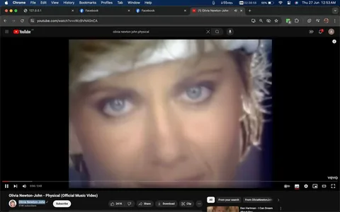 The image is a screenshot from a YouTube video titled "Olivia Newton-John - Physical (Official Music Video)." The video is available on the channel "Olivia Newton-John," which has 374K subscribers. The screenshot captures a close-up of a woman's face, focusing on her eyes. Her expression is intense, set against a soft, blurred background that emphasizes the close-up nature of the shot. The lighting is soft, highlighting the woman's features and enhancing the mood of the scene.
The YouTube interface is visible with options such as "Share," "Download," and "Clip," along with the like count of 241K. The video is associated with the music video for the song "Physical," which is a well-known pop hit from the 1980s. The screenshot reflects a nostalgic and iconic moment from the era, capturing the essence of Olivia Newton John’s vibrant and dynamic performance style. The overall mood is energetic and engaging, typical of music videos from that time.