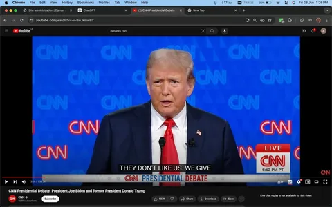 1) The image is a screenshot from a YouTube video showing a CNN Presidential Debate featuring Donald Trump. He is speaking in front of a blue background with multiple CNN logos. Trump is wearing a dark suit, a white shirt, and a red tie, and there is an American flag pin on his lapel. A microphone is positioned in front of him as he addresses the audience. The subtitle reads “THEY DON'T LIKE US. WE GIVE,” indicating part of his speech. The bottom of the screen displays a banner that reads "CNN PRESIDENTIAL DEBATE," and the time is shown as 6:12 PM PT. The setting is indoors, with a formal and serious atmosphere typical of political debates. The video is hosted on the CNN channel on YouTube.
2) On-screen text block:
- Title: "CNN Presidential Debate: President Joe Biden and former President Donald Trump"
- Channel / profile: "CNN"
- Site / app: "YouTube"
- Captions / subtitles: "THEY DON'T LIKE US. WE GIVE"