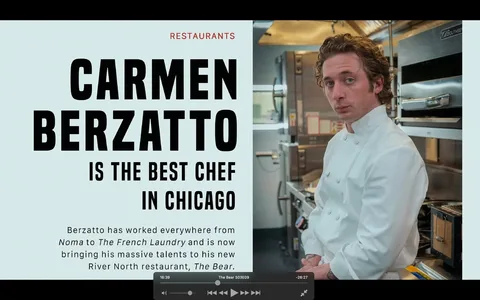 The image is a video frame from "The Bear," featuring a scene with the character Carmen Berzatto in a professional kitchen setting. Carmen is depicted wearing a crisp white chef's coat, leaning against a counter with a composed and confident expression. The kitchen is well-equipped, showcasing industrial ovens and stainless-steel surfaces, indicating a high-end culinary environment. The lighting is bright, highlighting Carmen and the modern kitchen equipment around him.
On the left side of the frame, bold text emphasizes Carmen Berzatto's status as "the best chef in Chicago," noting his experience at prestigious restaurants like Noma and The French Laundry. This text suggests a narrative of excellence and ambition, central to Carmen's character in the series. The overall mood is professional and aspirational, underscoring the theme of culinary mastery and the restaurant's reputation in Chicago's River North area.