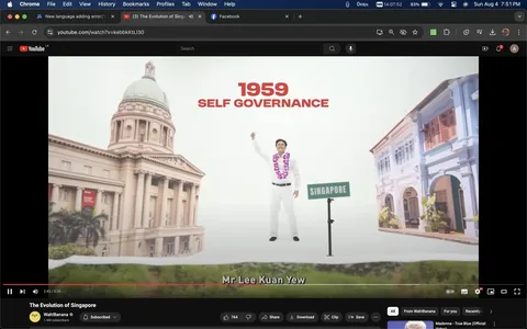 In this video frame from YouTube, part of the video titled "The Evolution of Singapore" by the channel Wah!Banana, a historical moment is depicted. The scene illustrates Singapore's 1959 self-governance milestone with the phrase "1959 SELF GOVERNANCE" prominently displayed in bold red letters. Below, a person representing Mr Lee Kuan Yew, dressed in a white suit adorned with a garland, raises a hand in a gesture associated with triumph or celebration. Nearby, a signpost labeled "SINGAPORE" emphasizes the location being referenced.
The background features architectural elements symbolizing Singapore's heritage, such as a classical building with a dome and columns on the left, and traditional shophouses on the right. The composition uses a clean, minimalistic style with a focus on the central figure and historical context. The lighting is bright, creating a clear and uplifting atmosphere that complements the theme of progress and independence. The overall tone of the frame is celebratory and informative, aimed at educating viewers about Singapore's significant historical event.
- Title: "The Evolution of Singapore"
- Channel / profile: "Wah!Banana"
- Site / app: "YouTube"
- Captions / subtitles: "Mr Lee Kuan Yew"